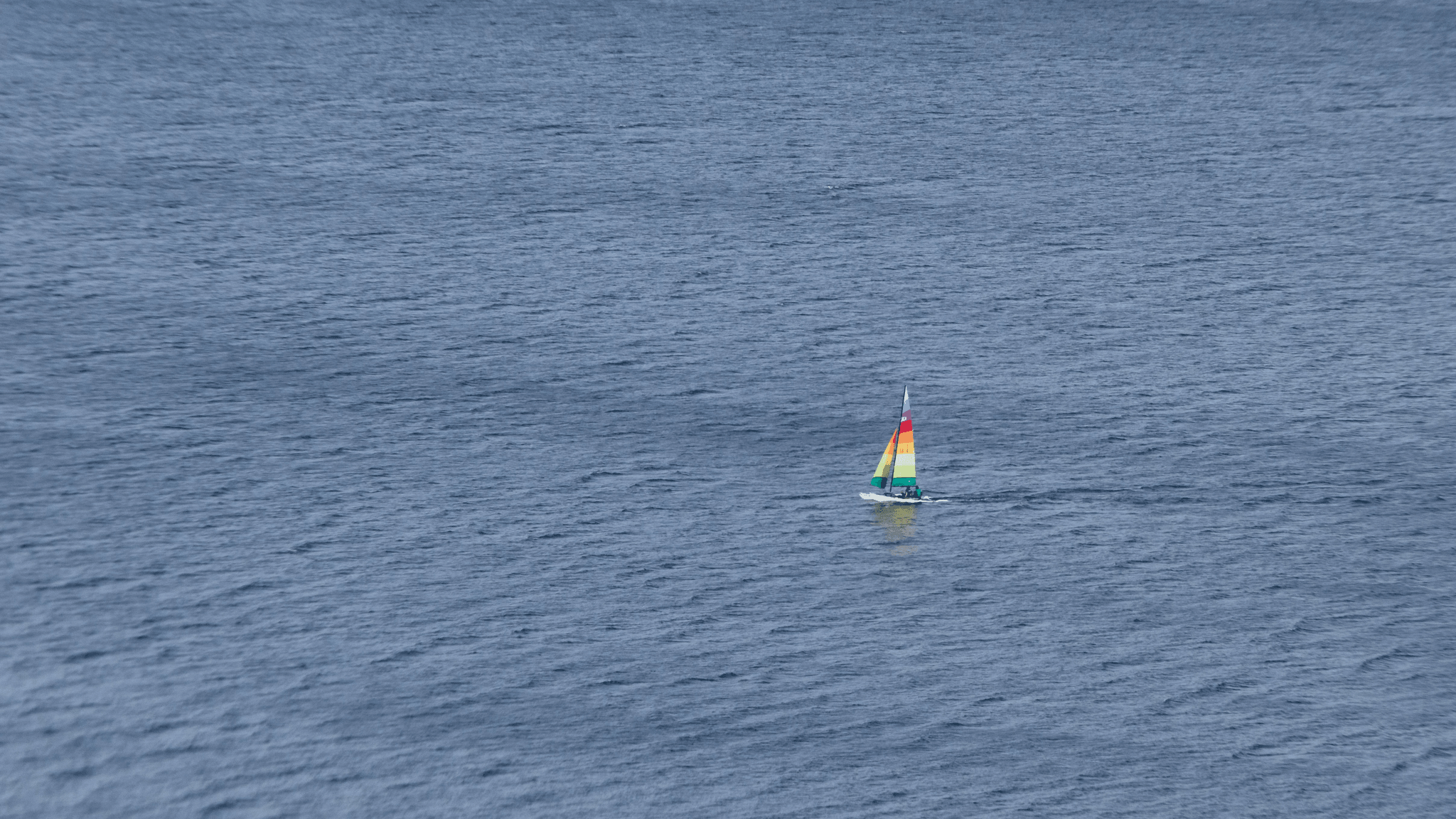 Small Aluminum Boat Sailing Smoothly on Calm Waters