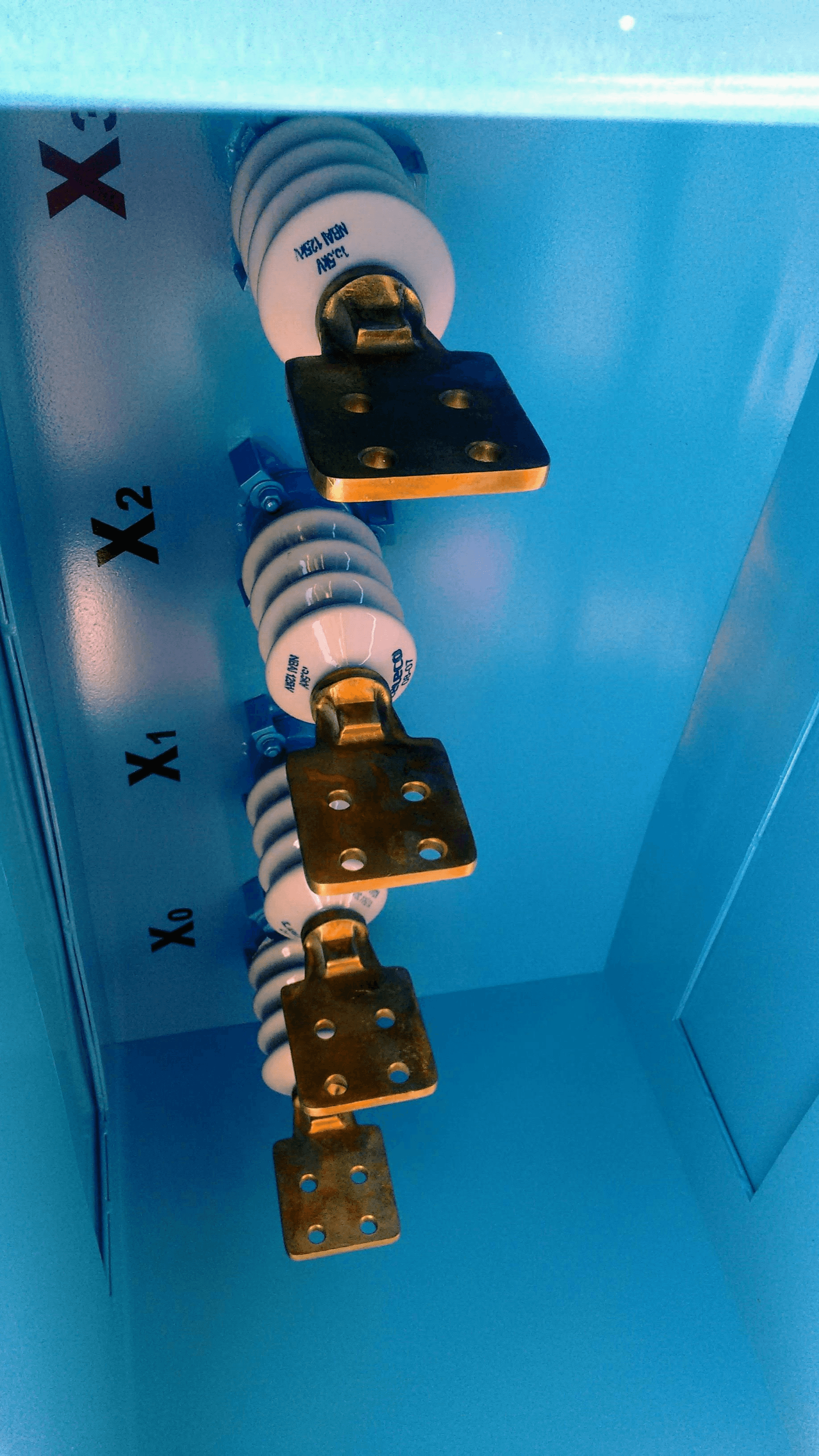 Detailed view of various transformer bushing parts for high voltage applications