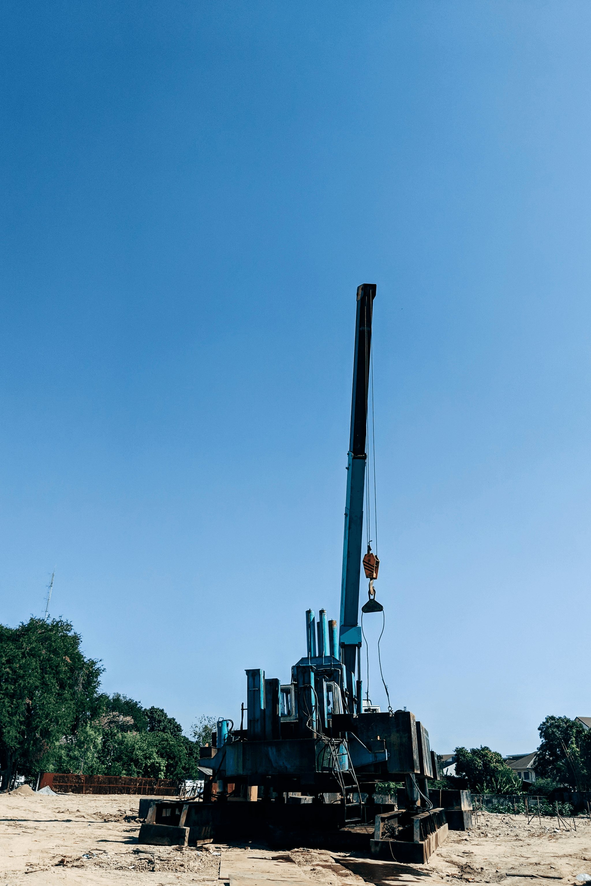 Crawler anchor drilling rig working on rocky terrain with down the hole drills