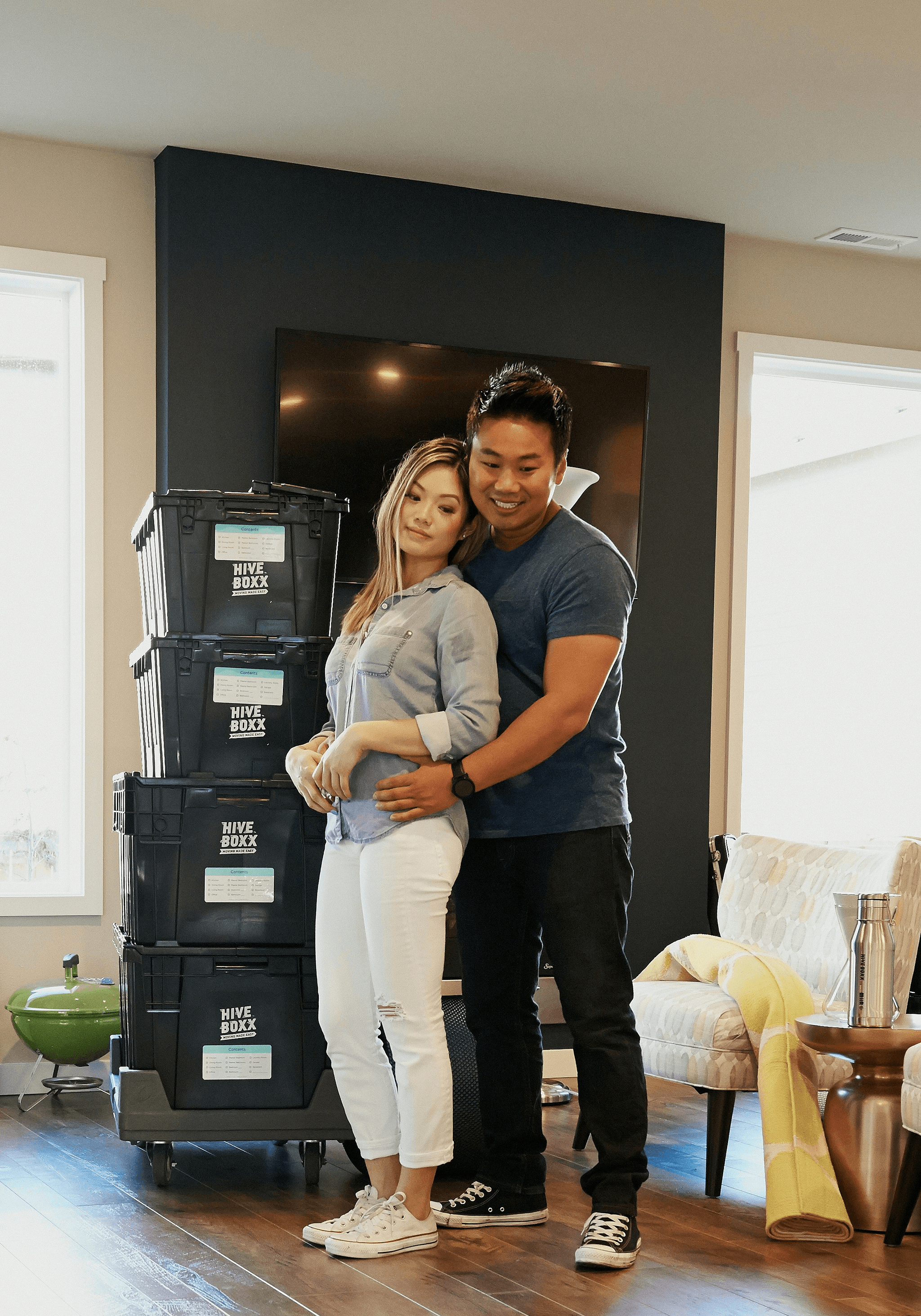Happy couple moving into their new storage container home