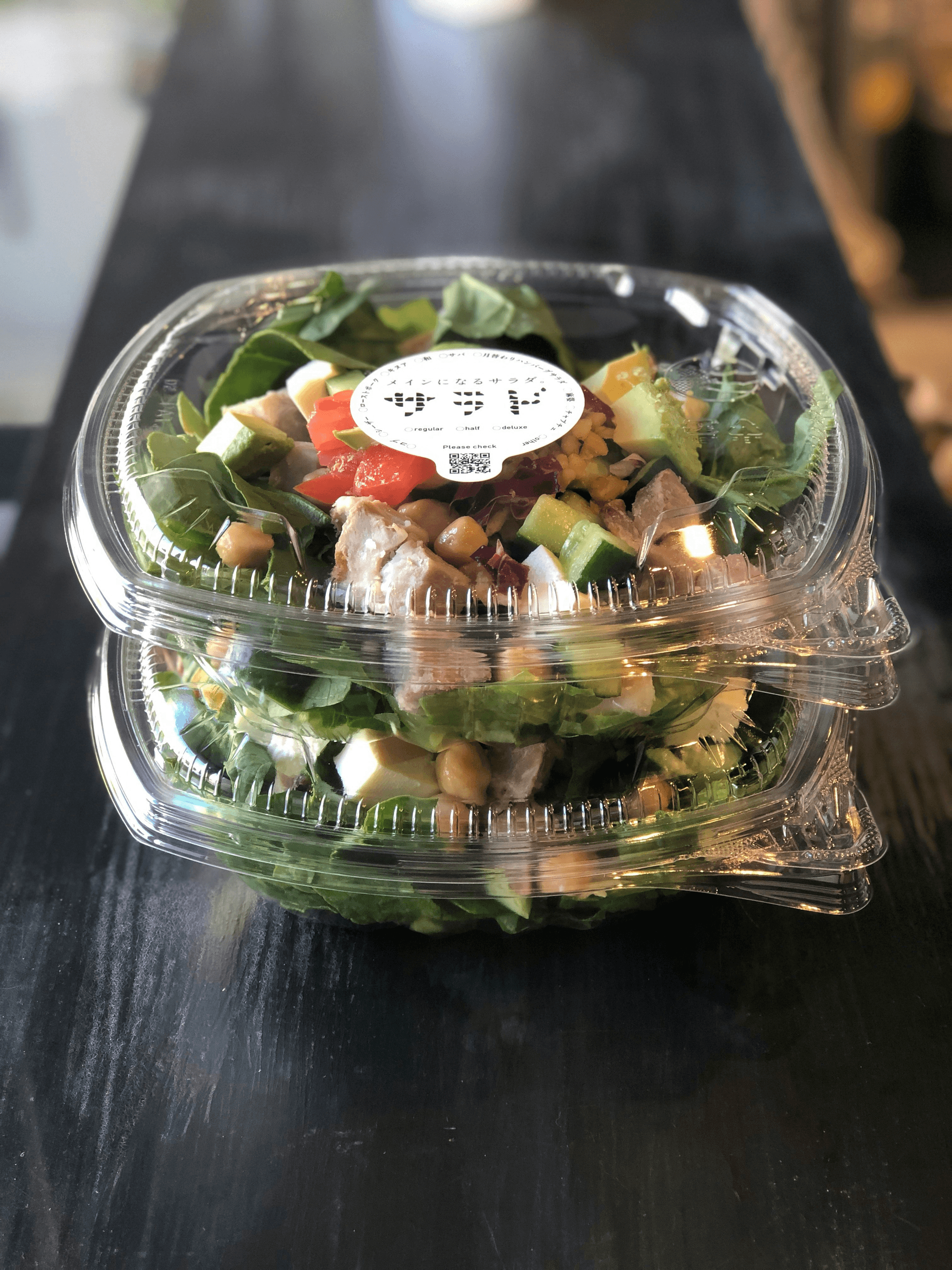 custom take out containers showcasing delicious salad in branded packaging