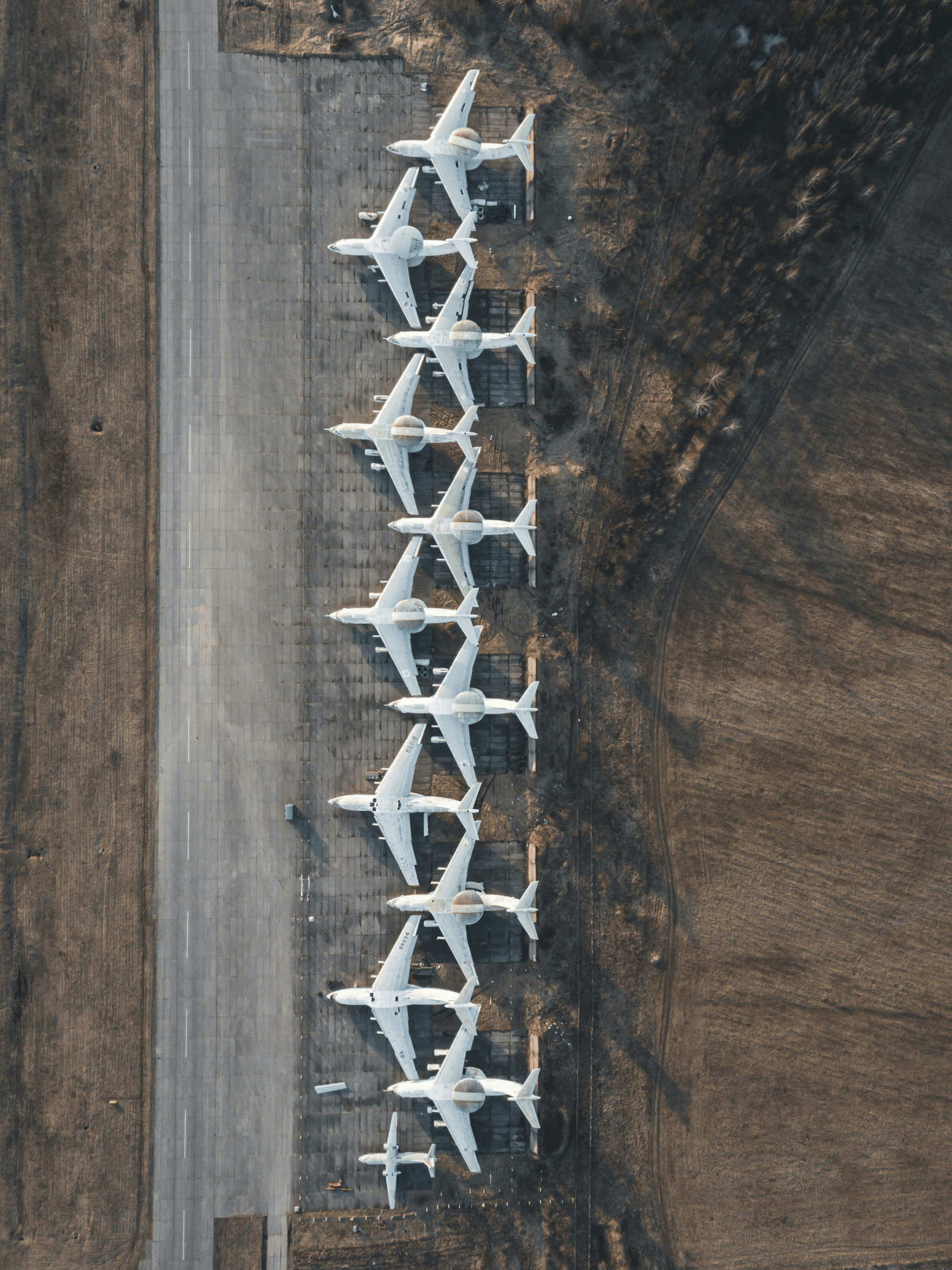Various types of aircraft fuel trucks ready for service.