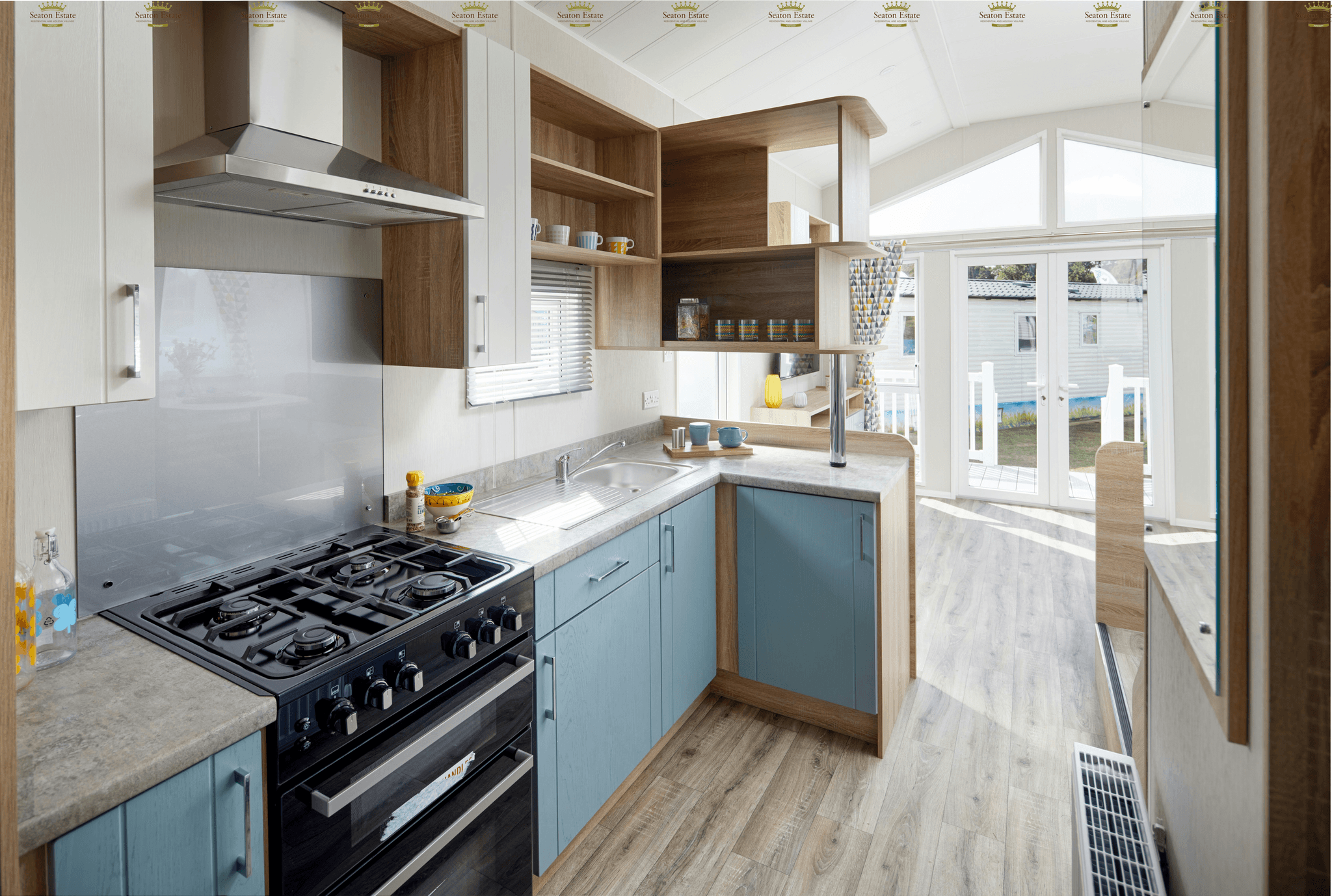 Modernized mobile home kitchen with upcycled cabinets.