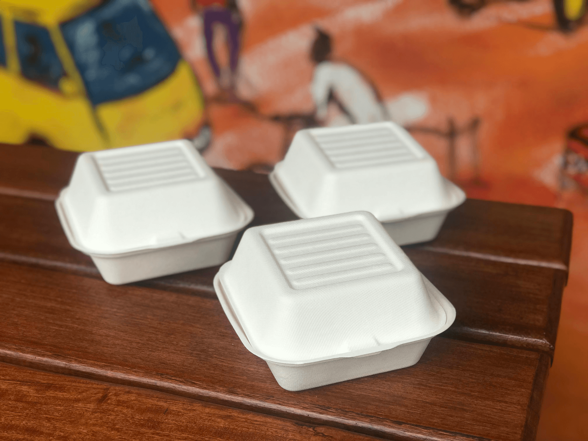 Collection of foam hinged lid containers ideal for food storage.