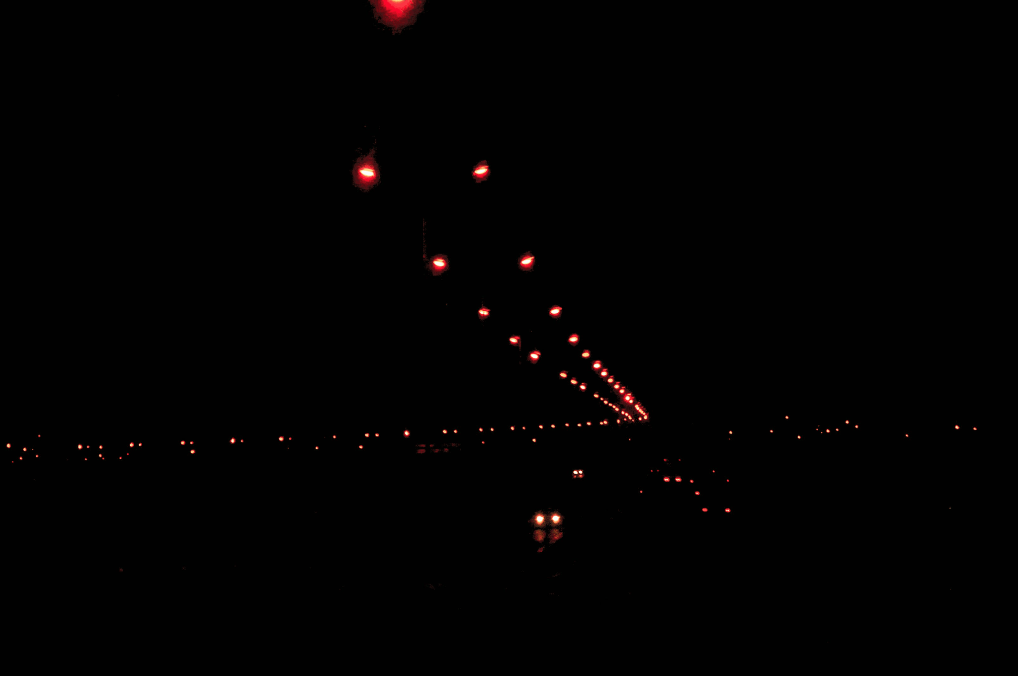 Brightly lit airport lights enhancing visibility during nighttime operations.