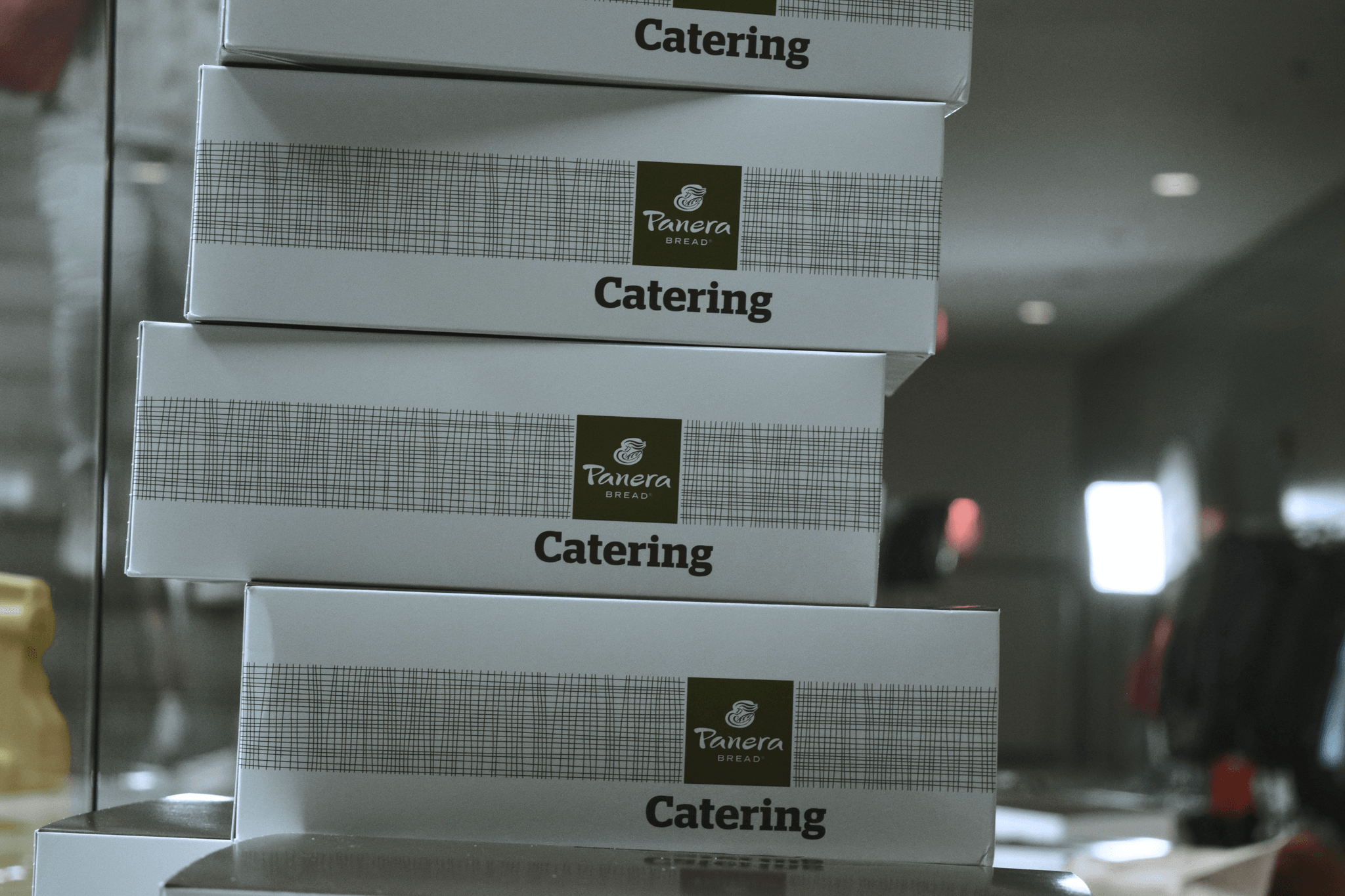 Personalized to go containers showcasing unique branding designs.