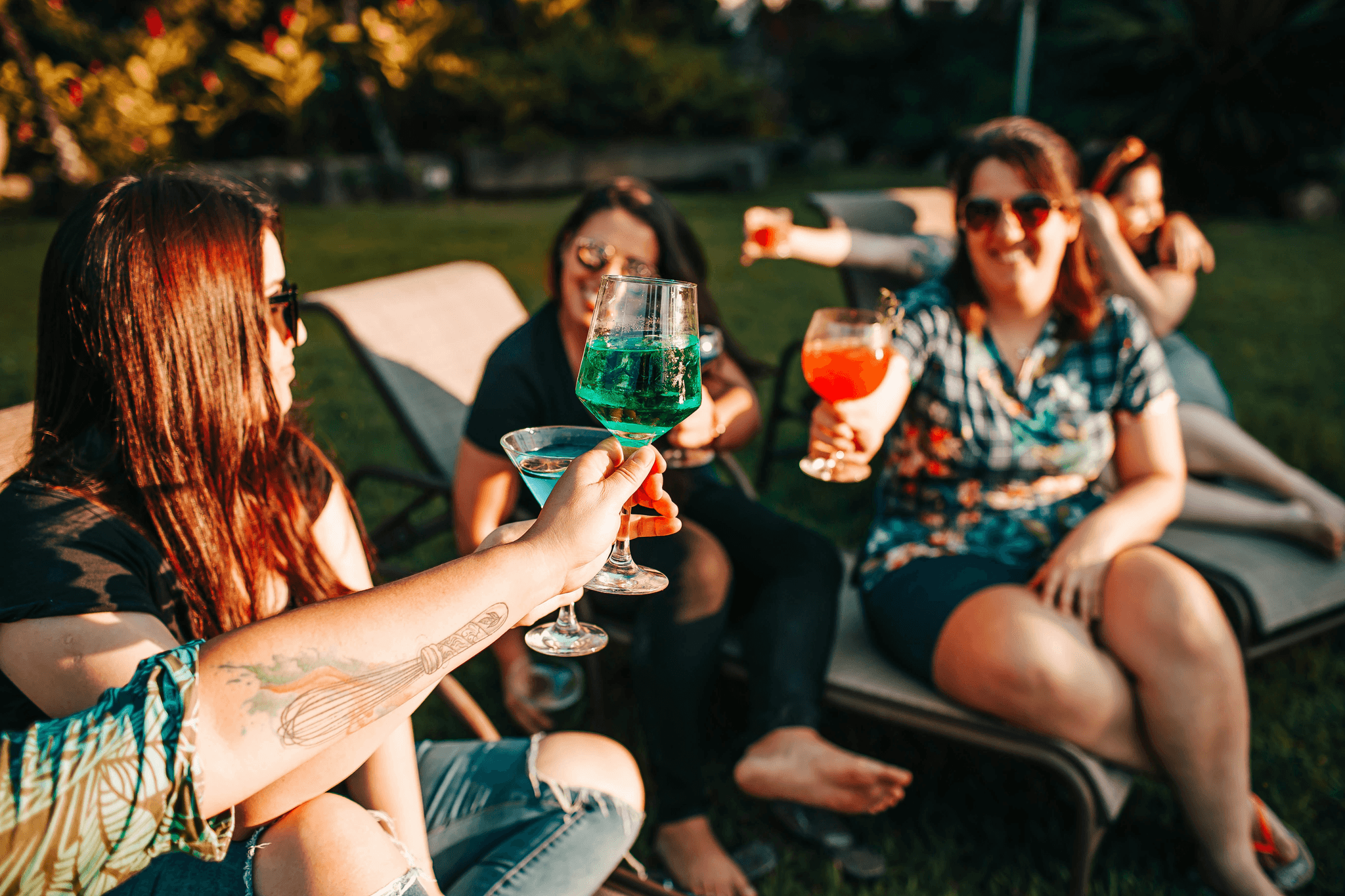 Outdoor portable bar setup with cocktails and games creating an inviting atmosphere