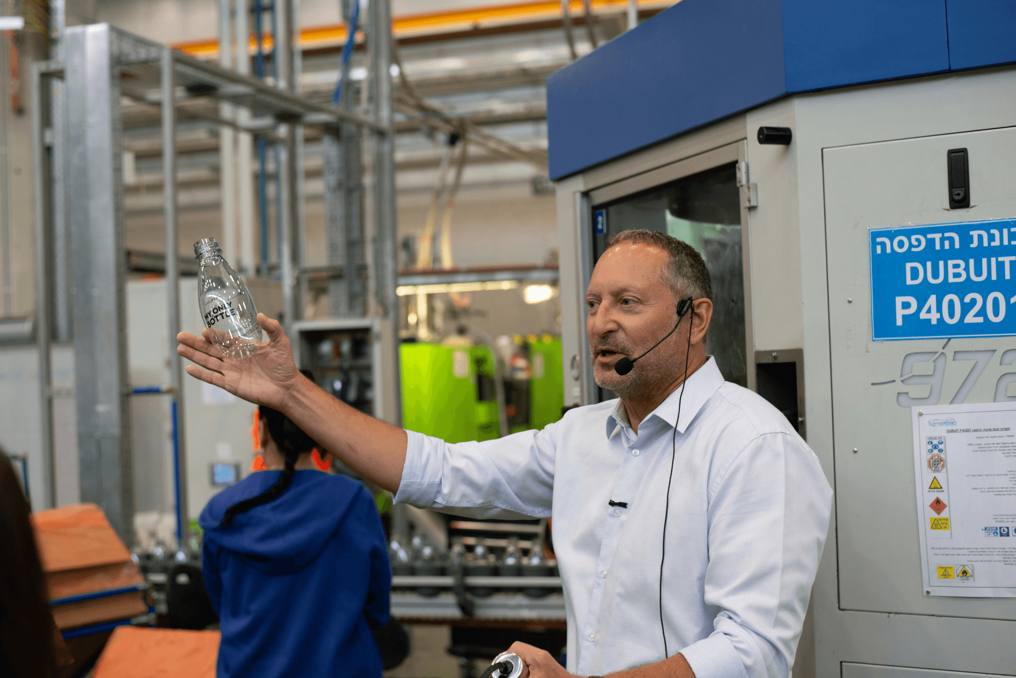 Illustration of advanced manufacturing technologies in action within a sustainable factory environment