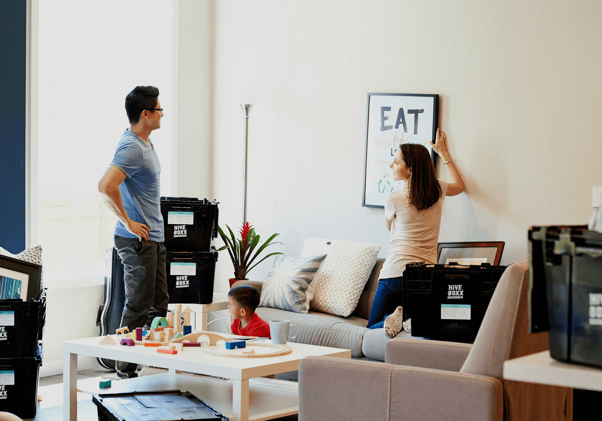 buy prefabricated house - happy family moving into their new prefab house