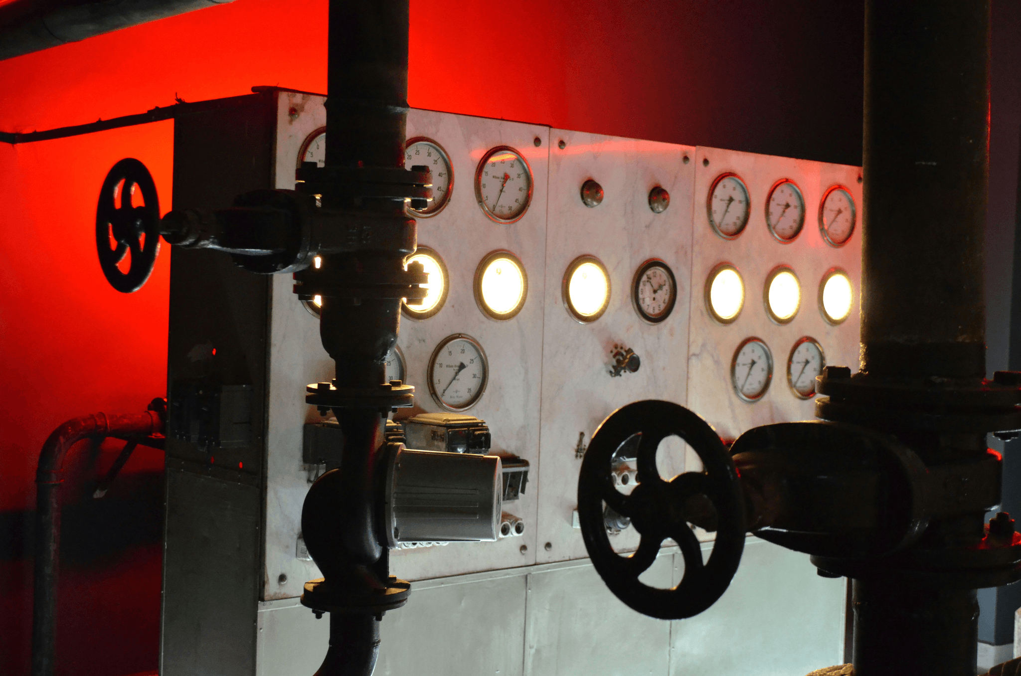Industrial boiler with inspection tools and gauges.