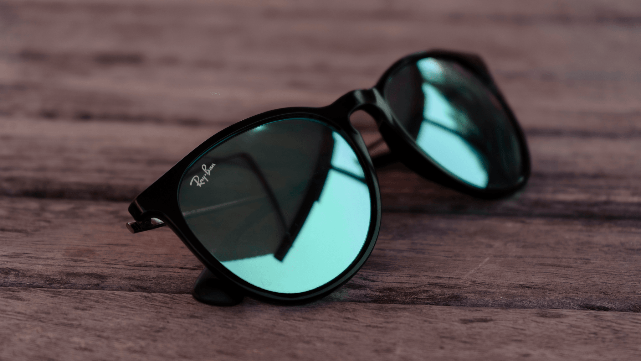 Stylish custom made sunglasses displayed on table