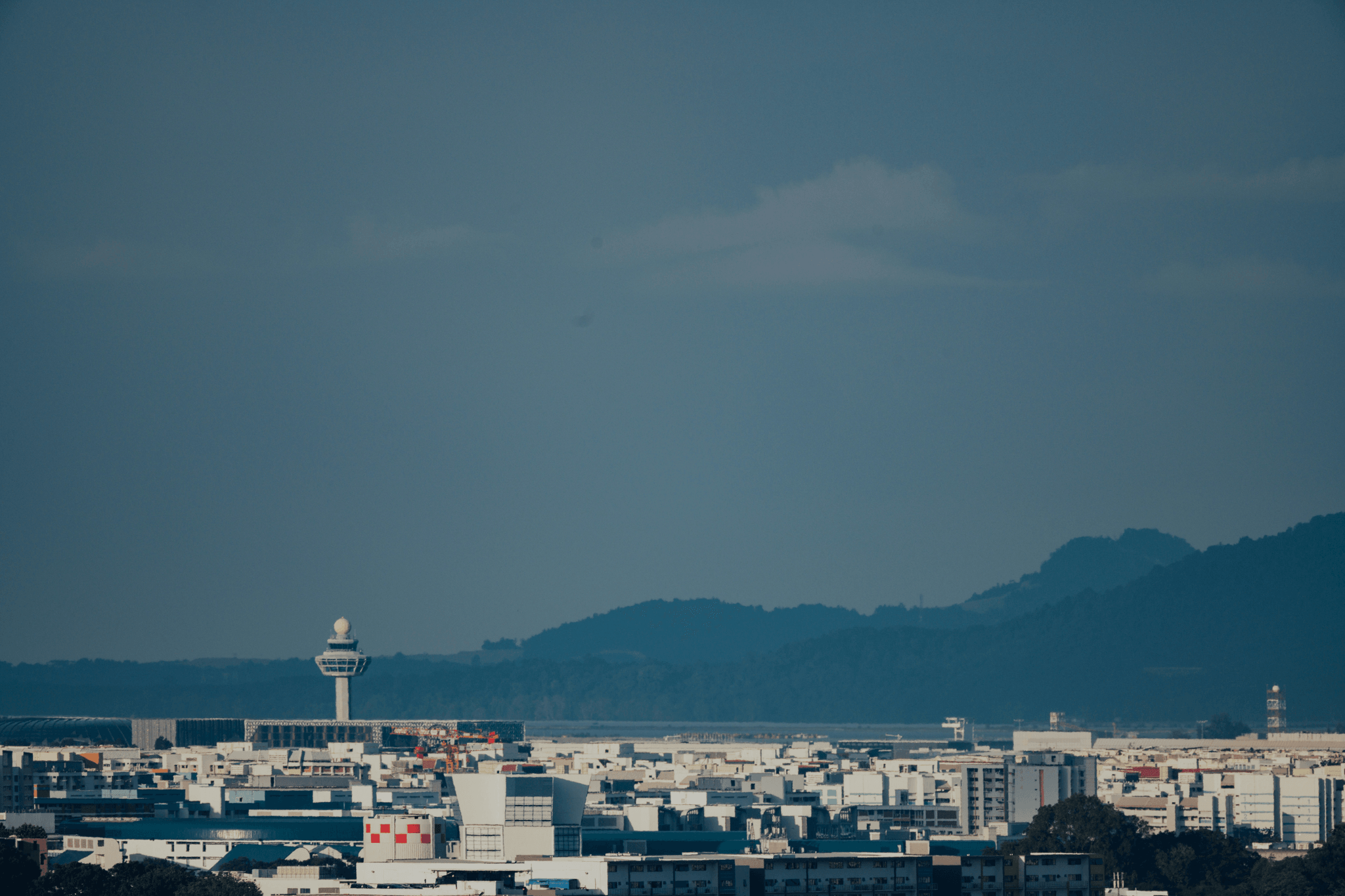Busy airport control tower managing aircraft safely.