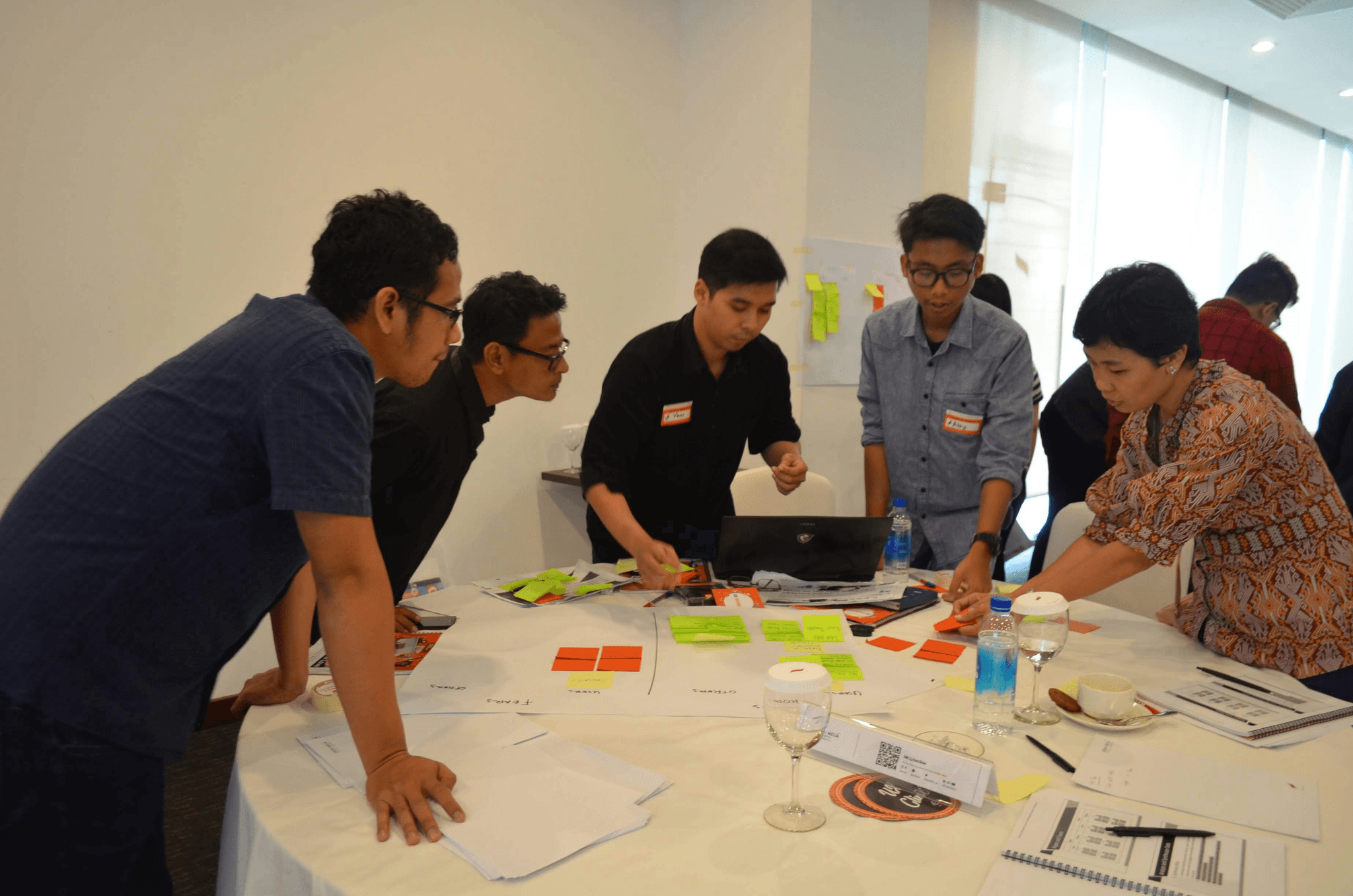 Team discussing strategies for improving Umbrella Quality Control Standards