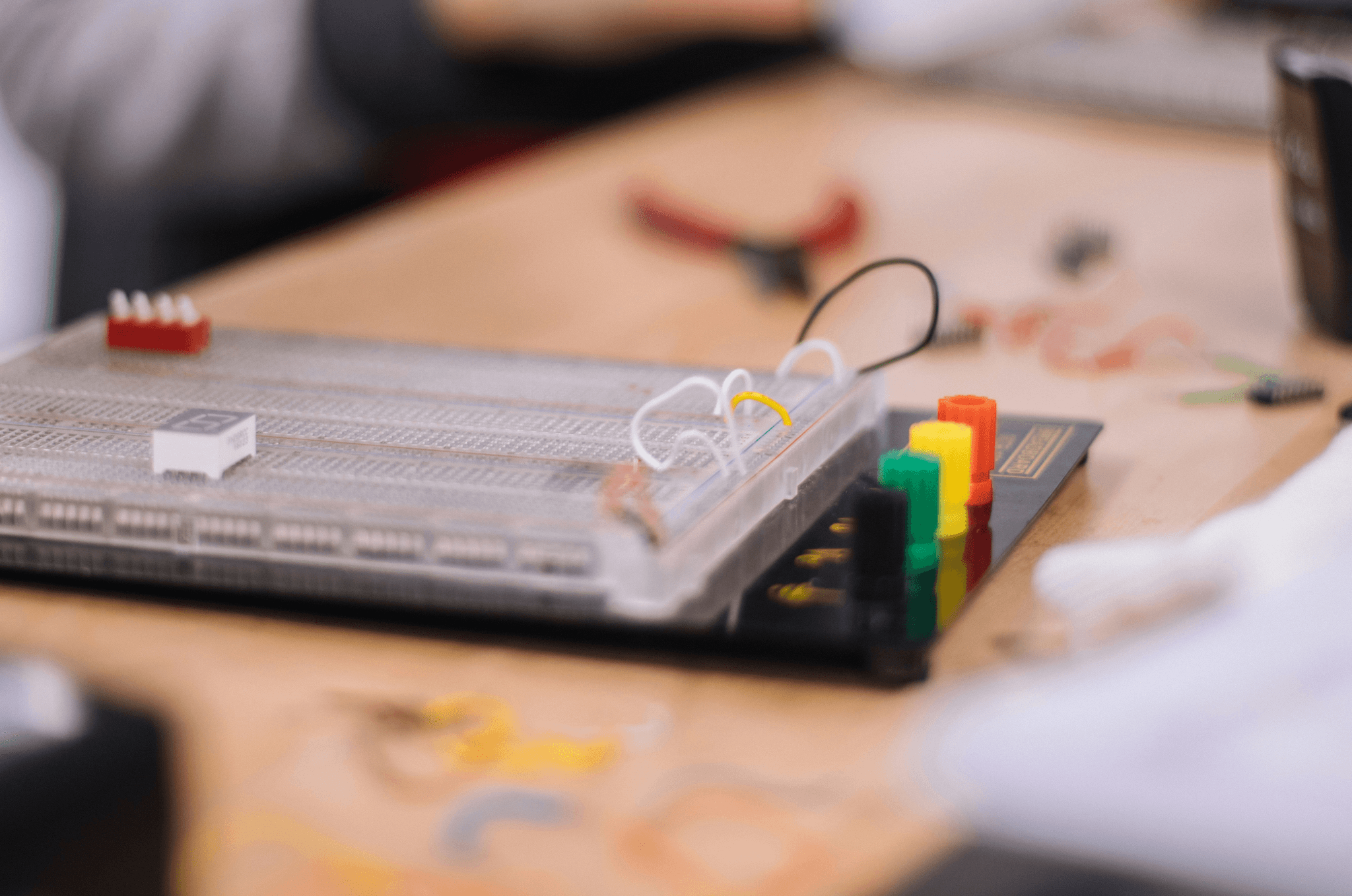 Illustration depicting testing of electronic components with tools.
