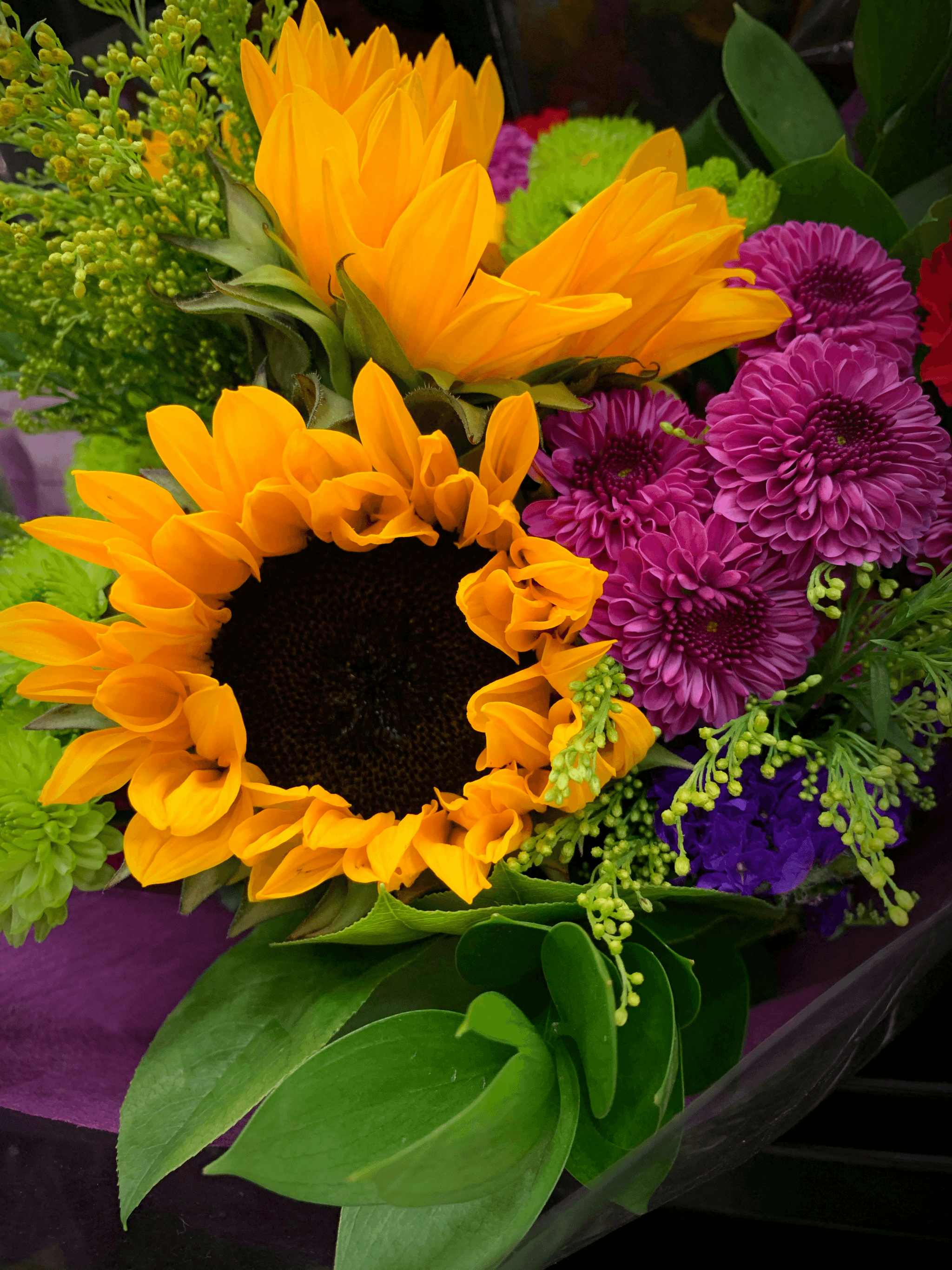 Beautiful pet-safe floral arrangement featuring sunflowers and roses.