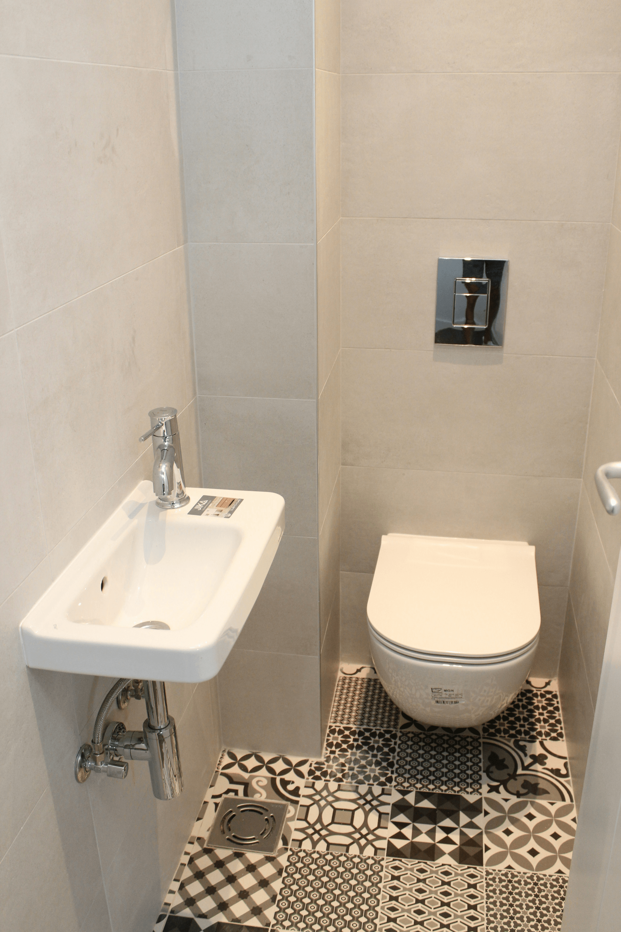 Modern bathroom with sleek tankless toilet from SSOURCING INC.