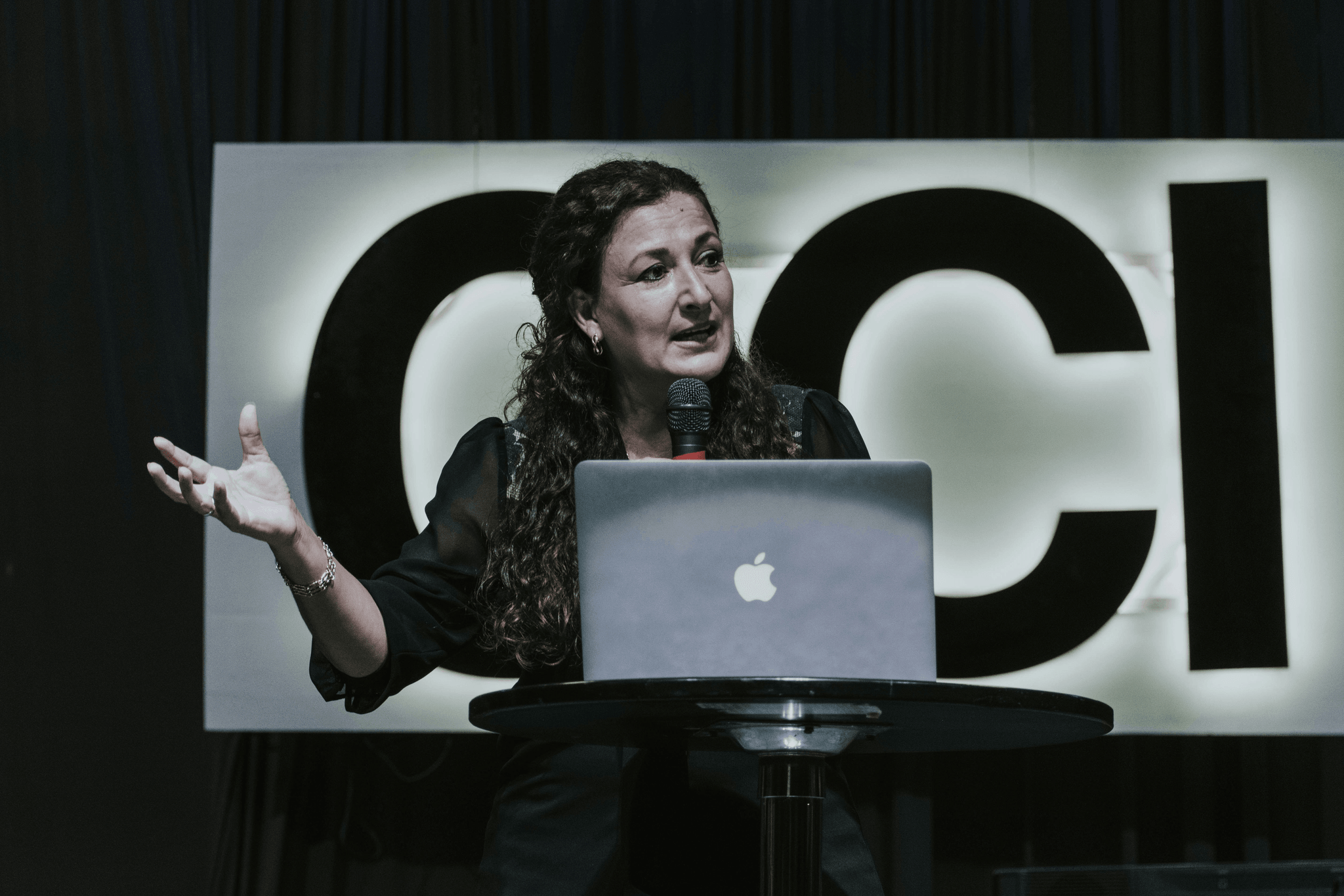 Female entrepreneur discussing business ideas for women at a tech conference