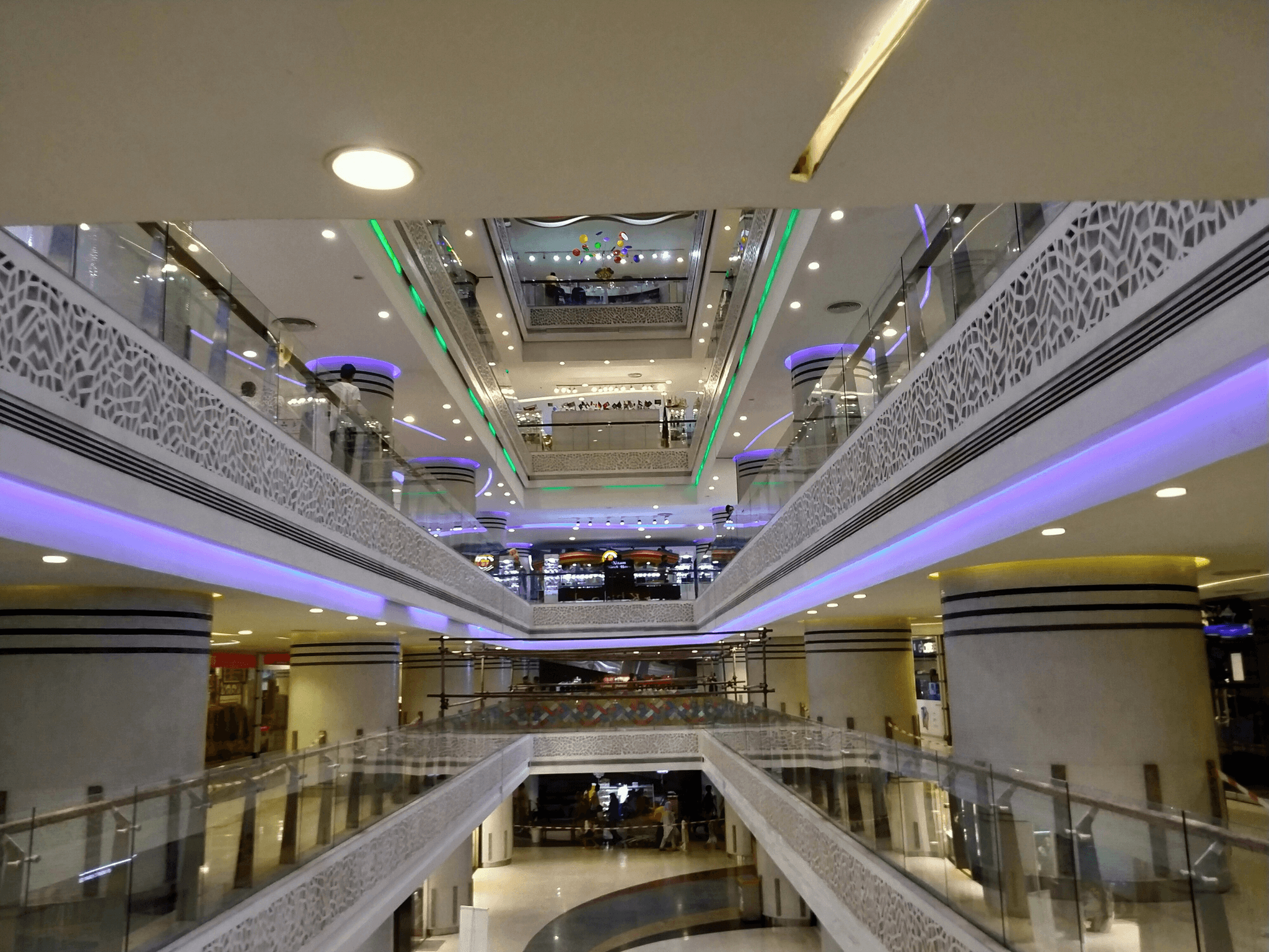 modern mall escalator connecting multiple levels in a shopping environment
