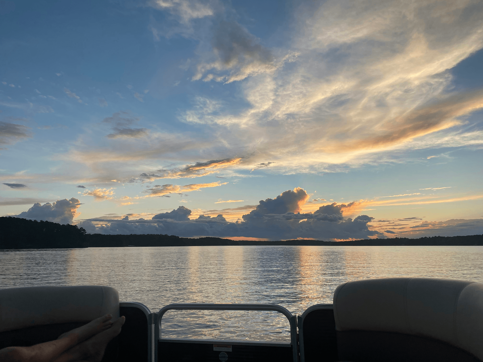 pontoon boat cost comparison during sunset