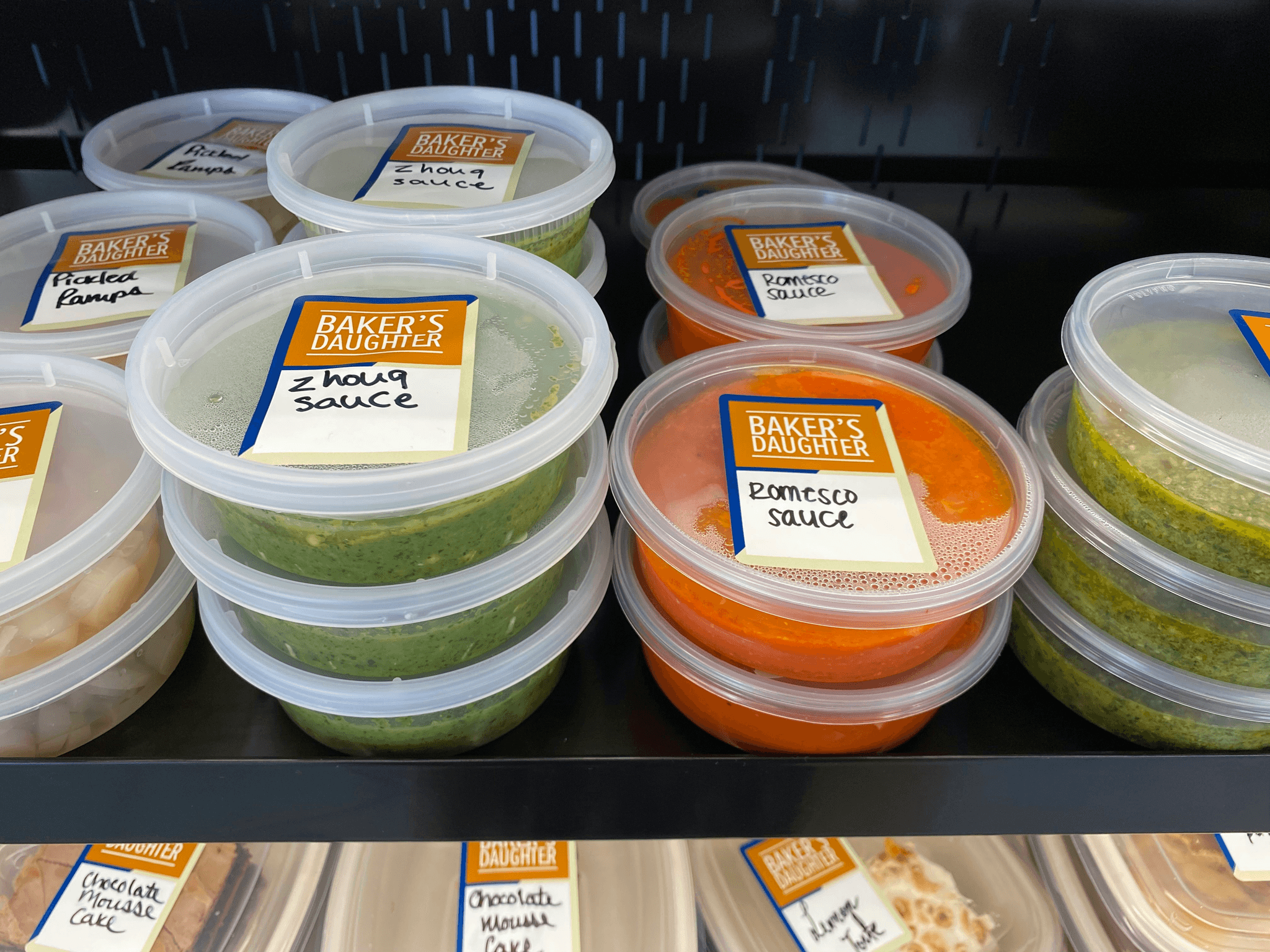Bulk containers with lids showcased alongside delicious food items