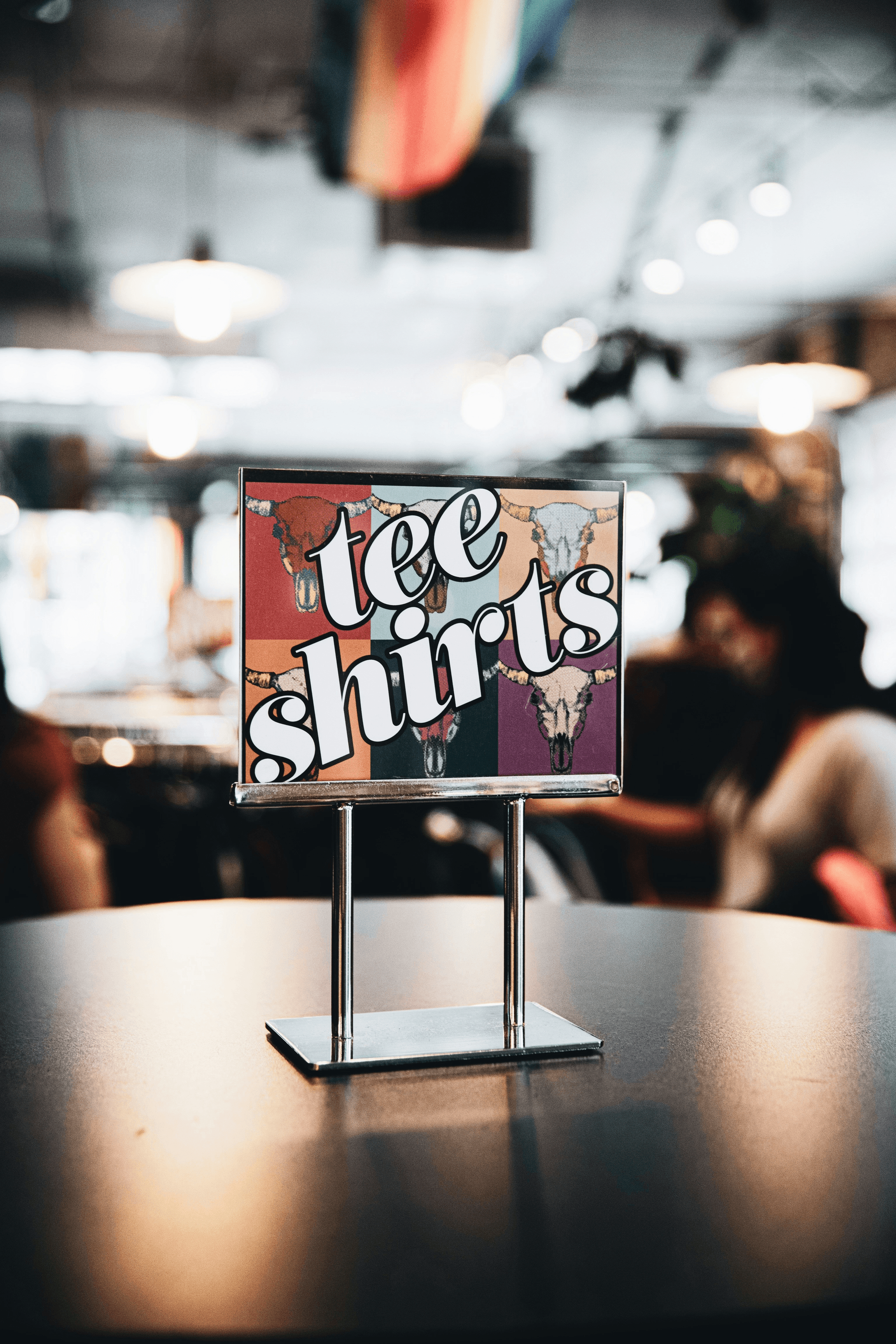 Vibrant storefront showcasing custom shirts from SSOURCING INC.