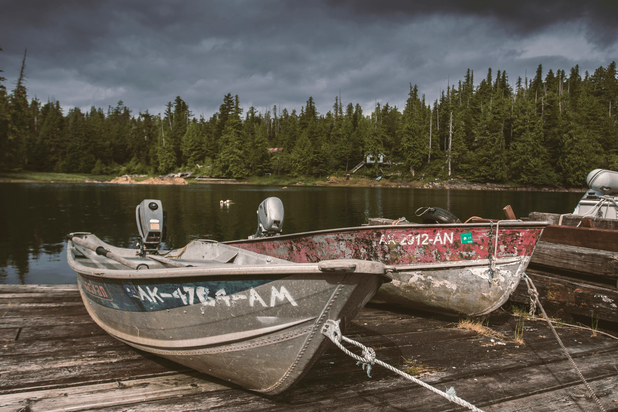 Lightweight aluminum boats lined up at dock ready for adventure.