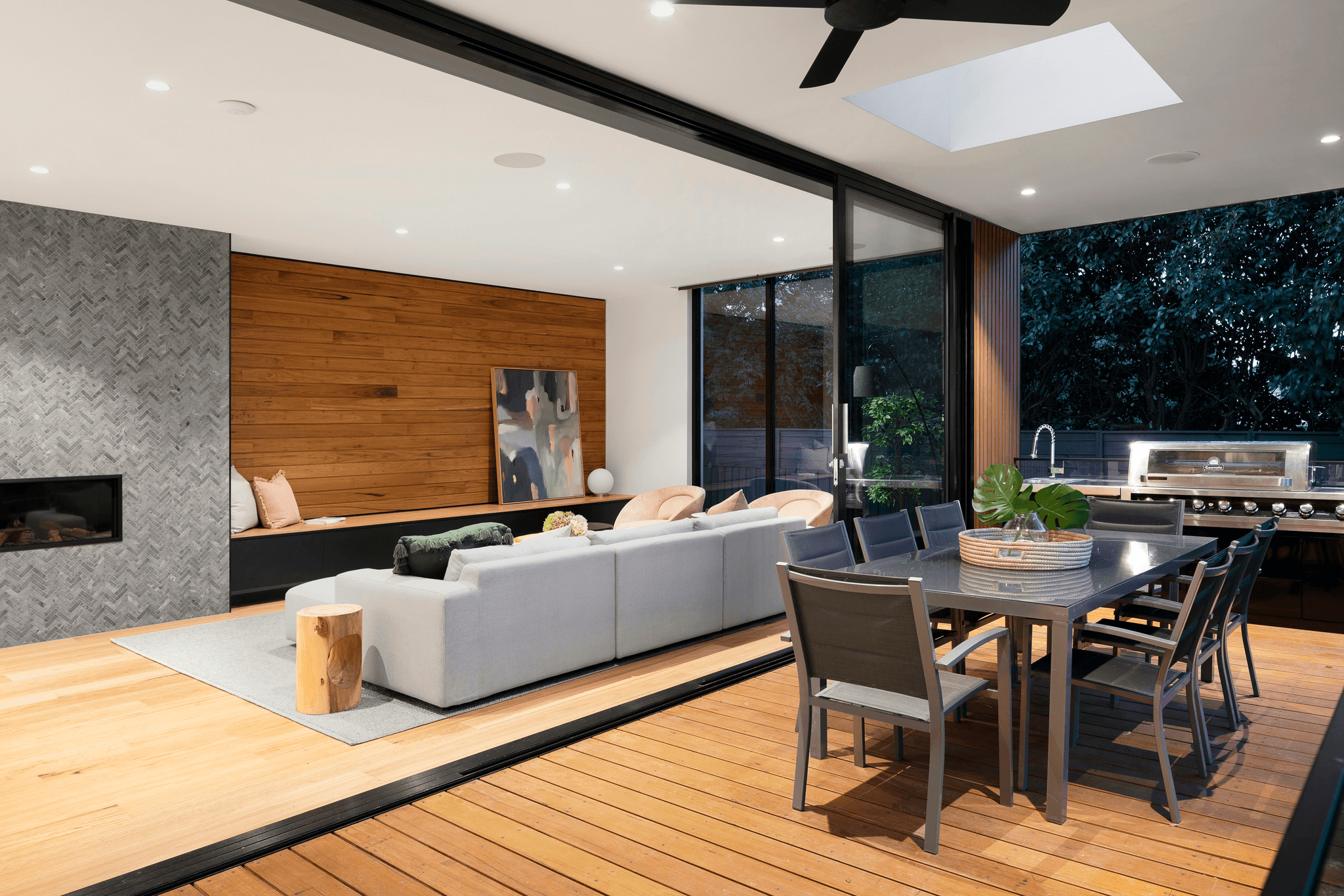 This is an image that shows an indoor-outdoor concept living in Indonesia with modern furniture, large teak wood deck.