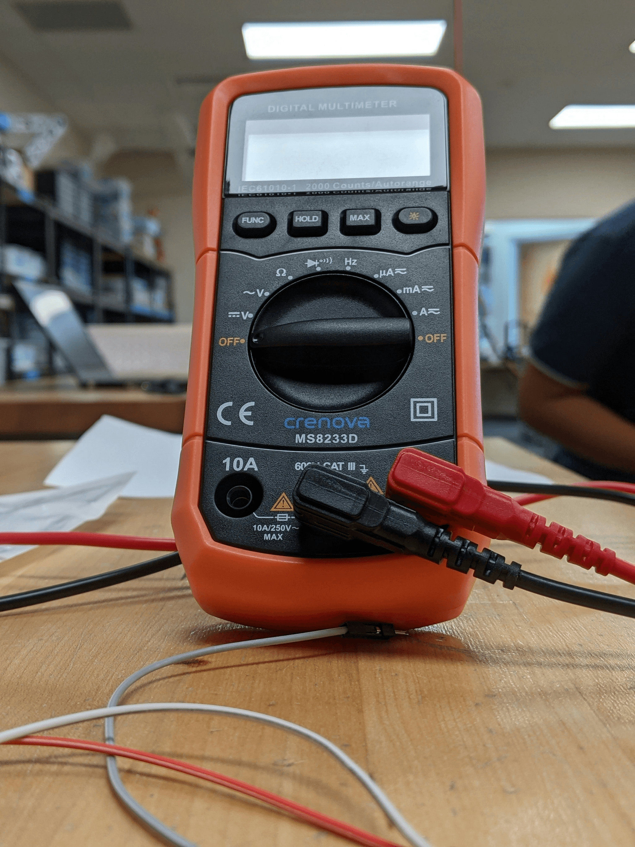 Electrical toy testing setup with tools and equipment