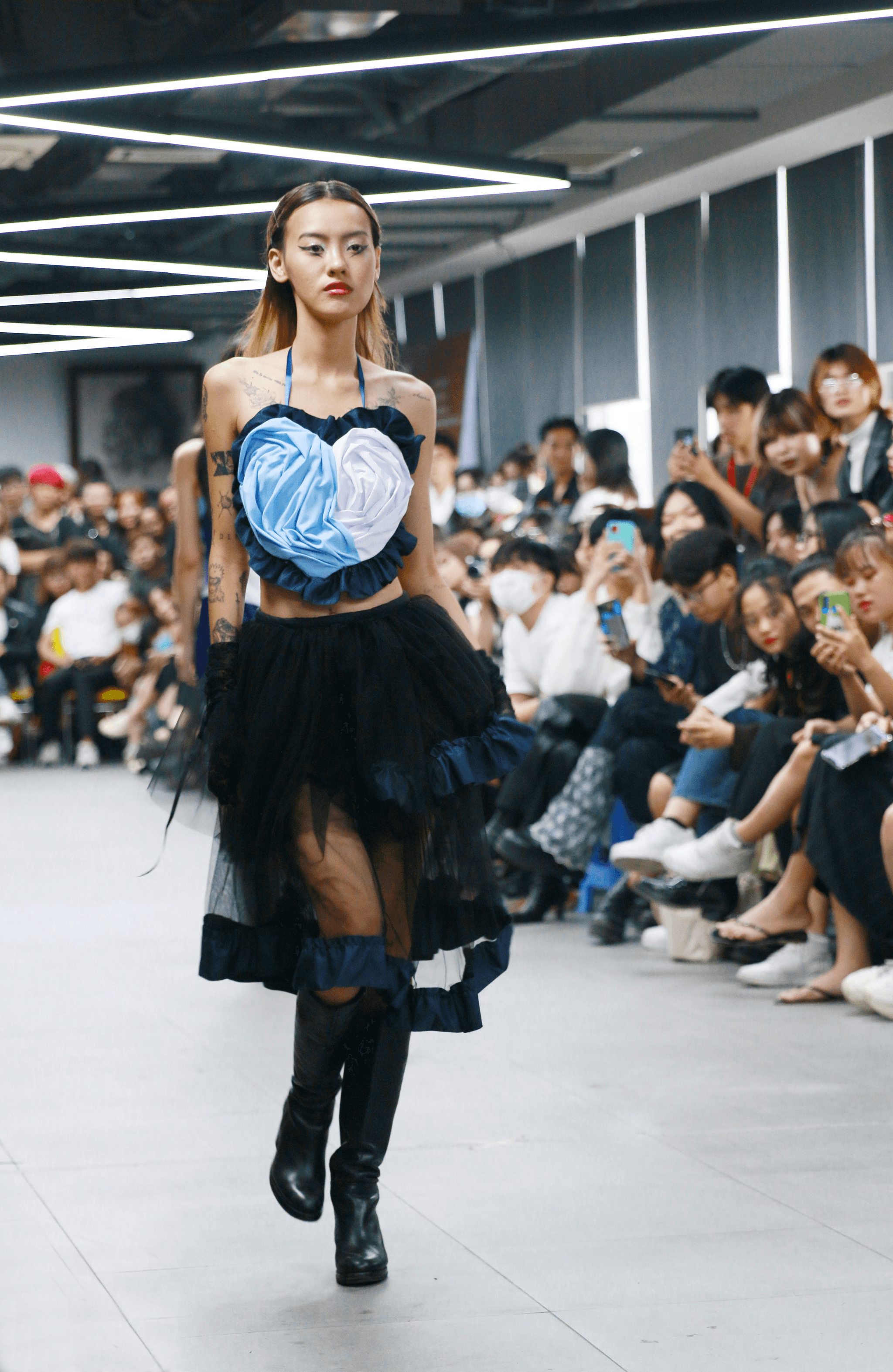 Clothing made in China: Innovative designs from top Chinese clothing brands on display at a modern runway.