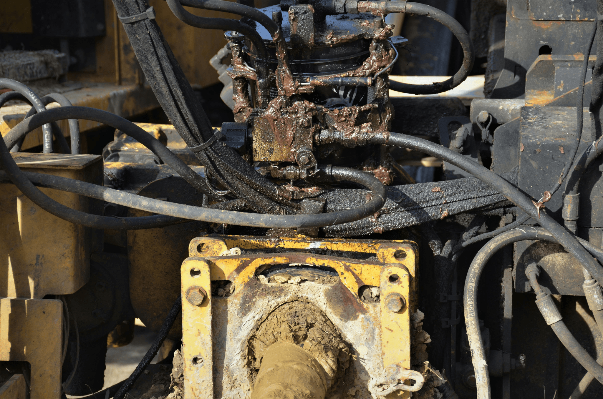 Excavator inspection China reveals worn hydraulic hoses and damaged bucket teeth.