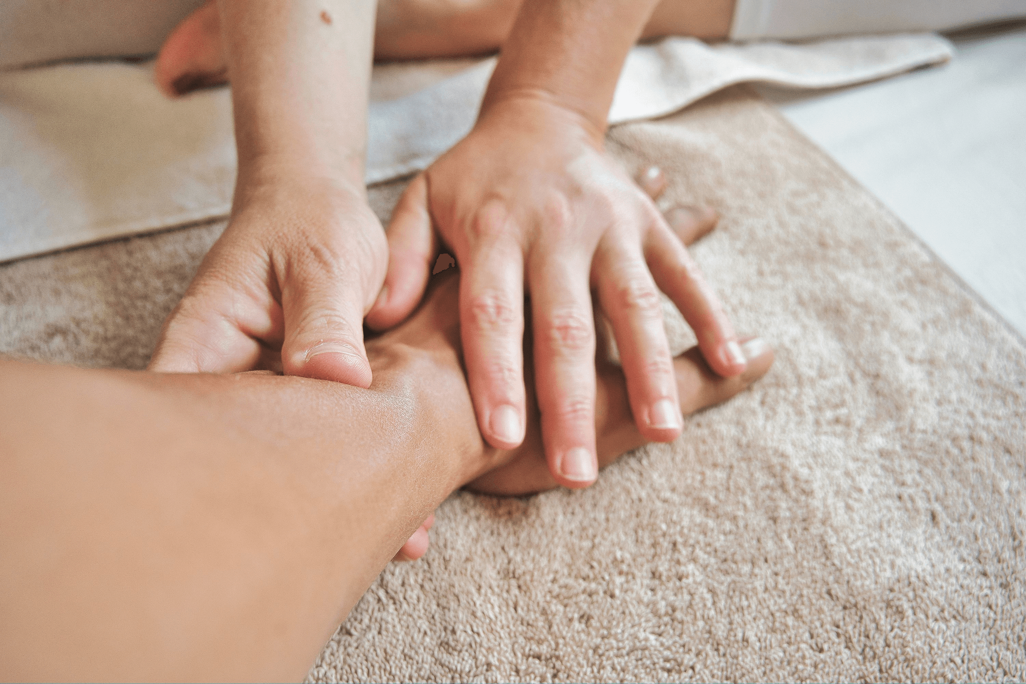Close-up of a client's hands being massaged during a beauty treatment at OMG Hair and Beauty.