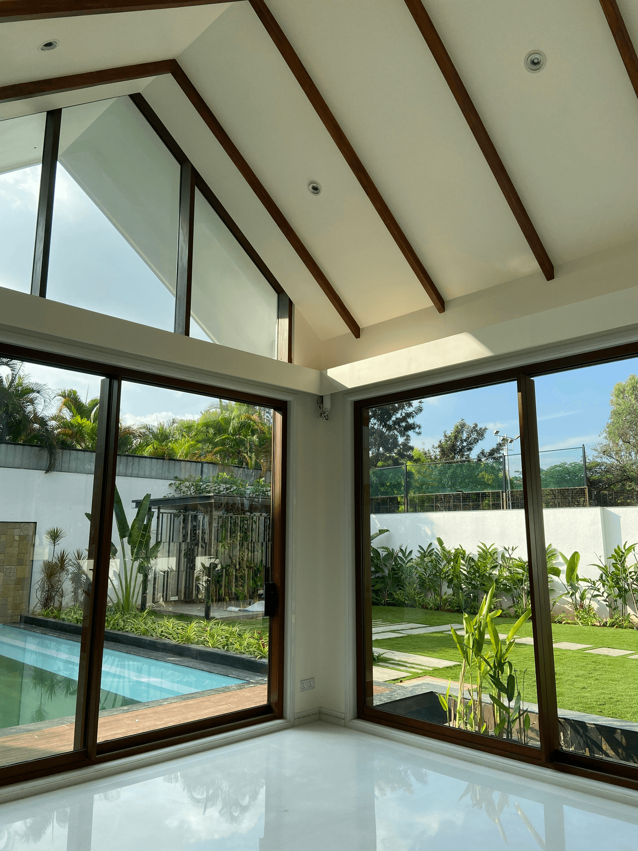 modern prefab house with glass walls and sun room