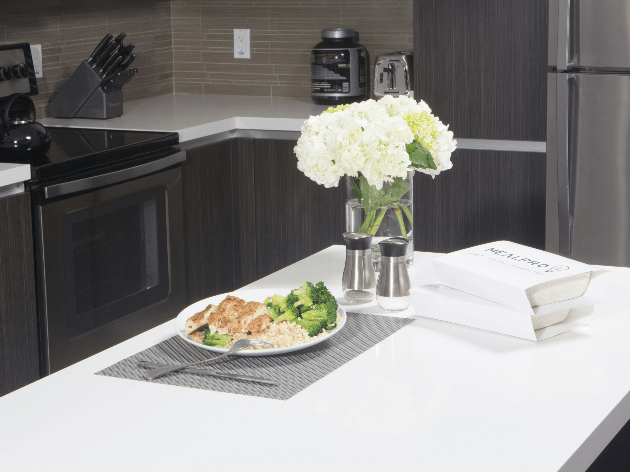 Efficient use of foldable kitchen countertops in an expandable container house