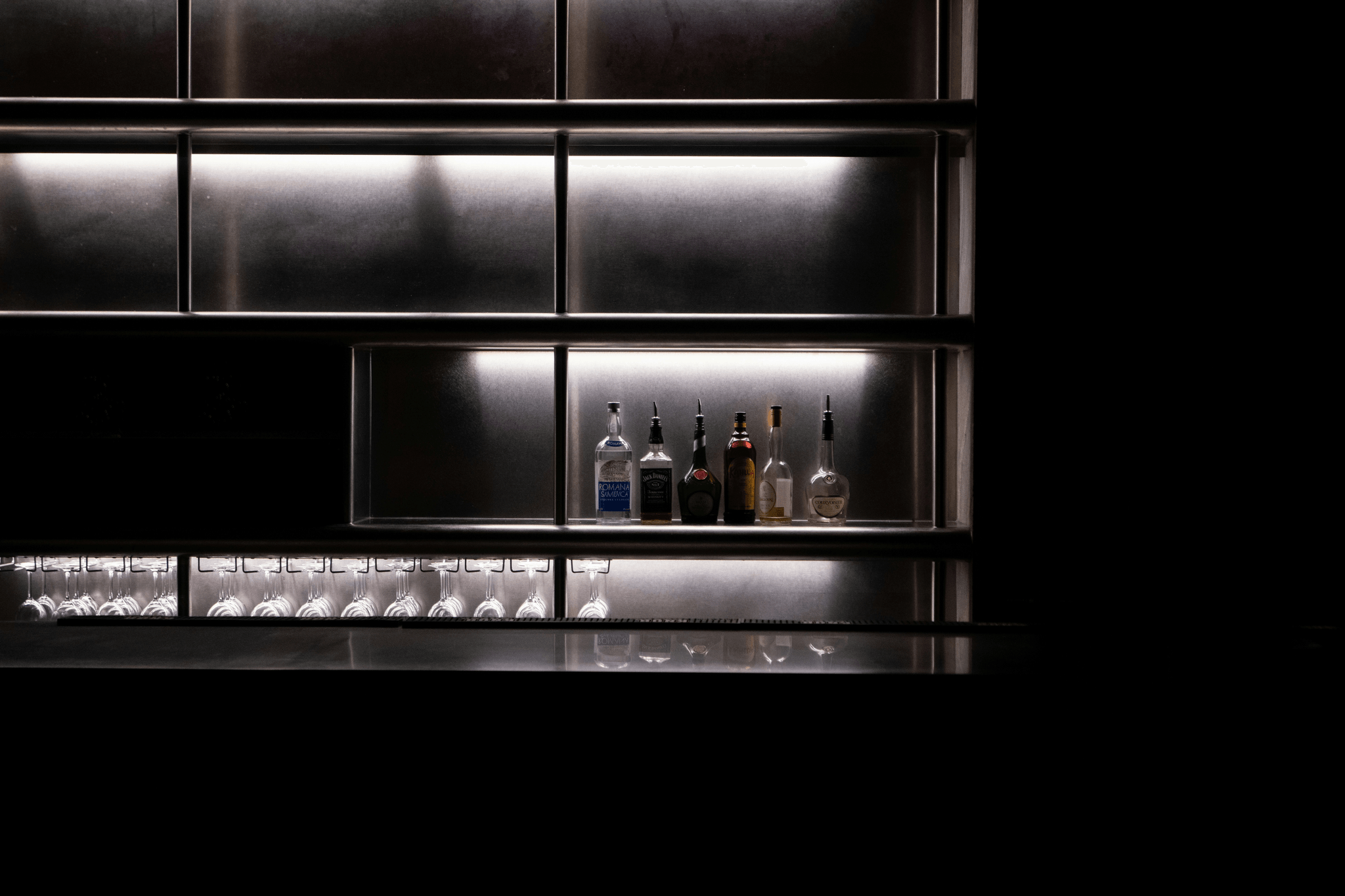 Stylish modern moveable bar setup with ambient lighting.