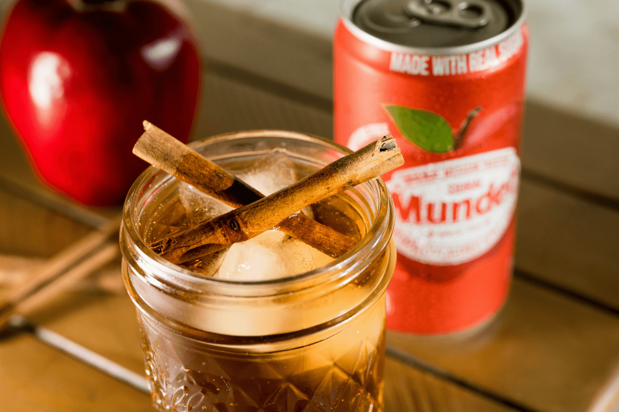 Apple Pie Hive Craft Cocktail infusion kit featuring dehydrated apples, cinnamon sticks, and infused sugar cubes in a glass jar labeled “Pour Decisions Perfected.” A cozy, spiced blend for crafting fall-inspired cocktails