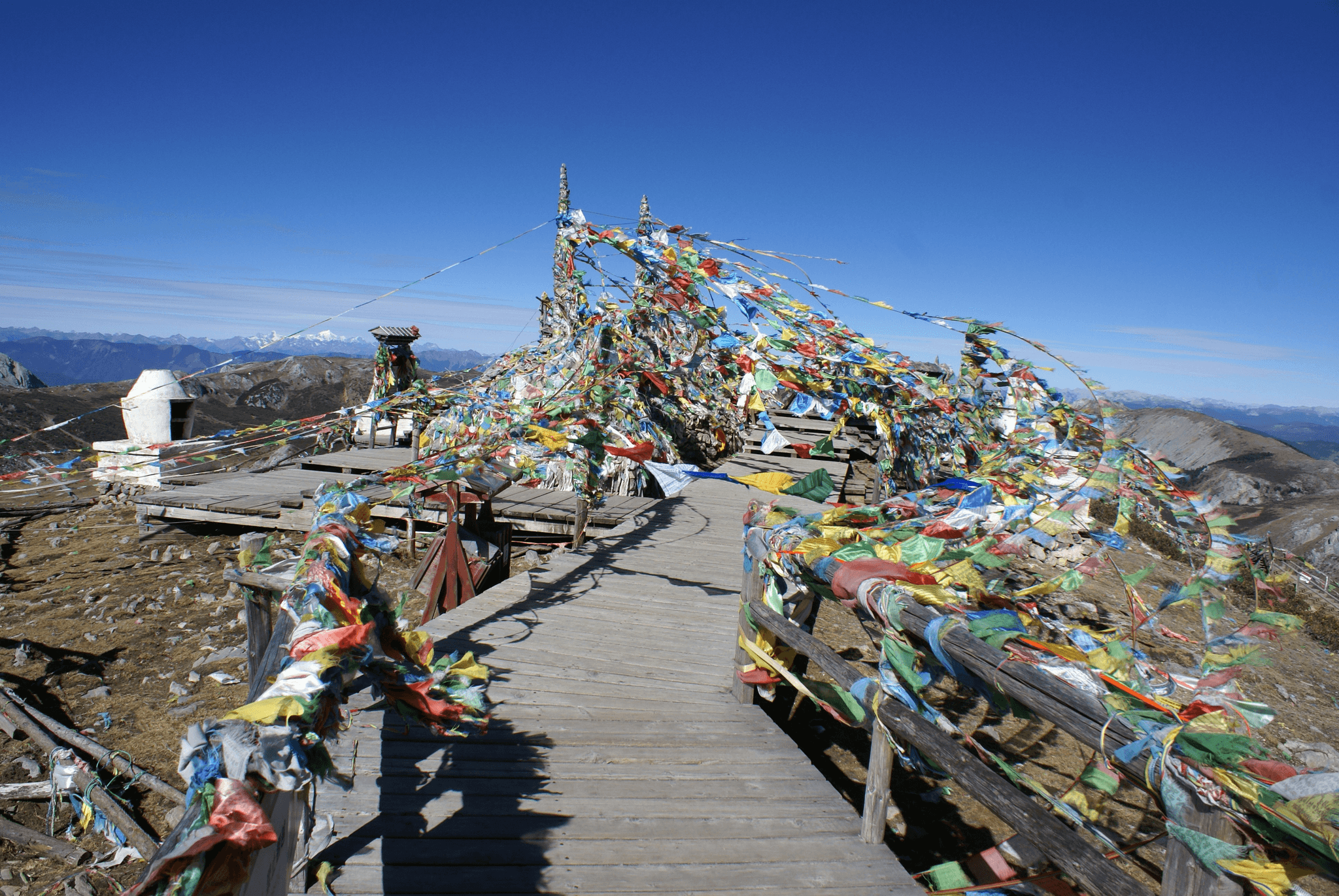 Holy Tibetan Stupa surrounded by pilgrims and mountains