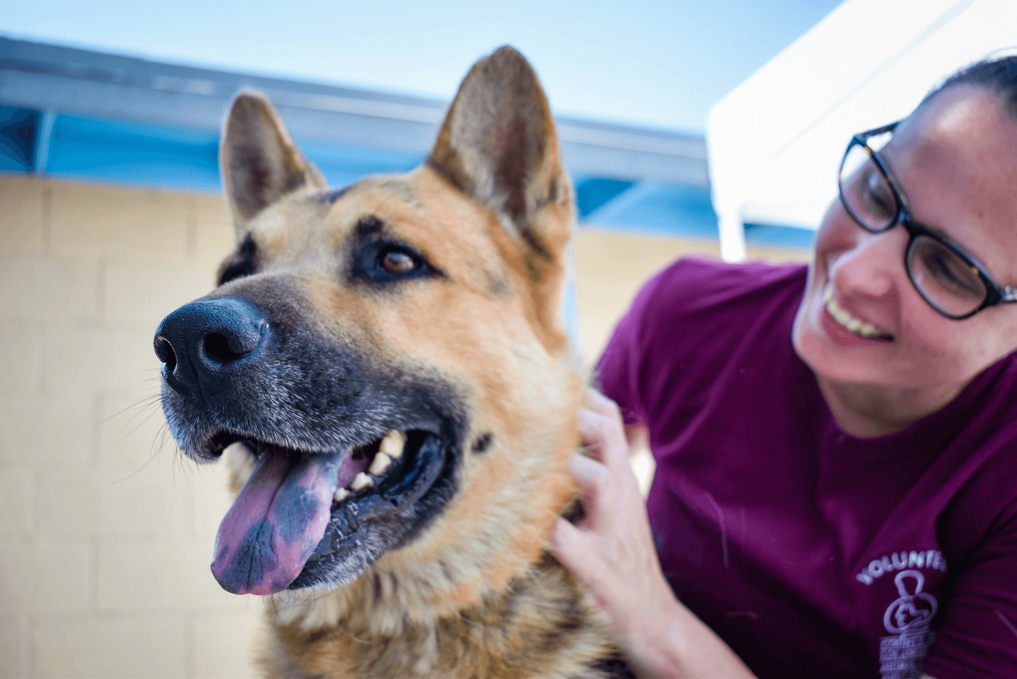 A relieved pet owner smiling after a vet visit with their pet