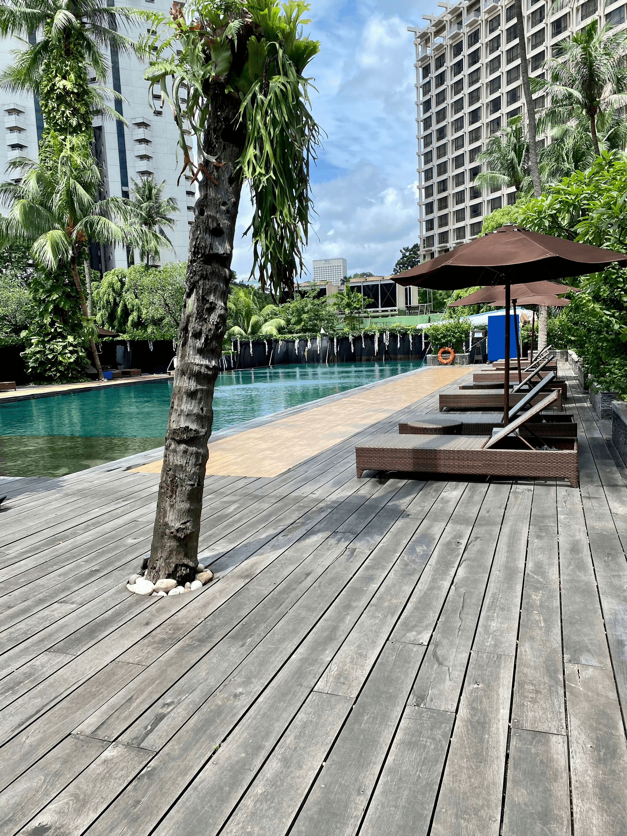 Beautiful wood deck around pool enhancing outdoor living space