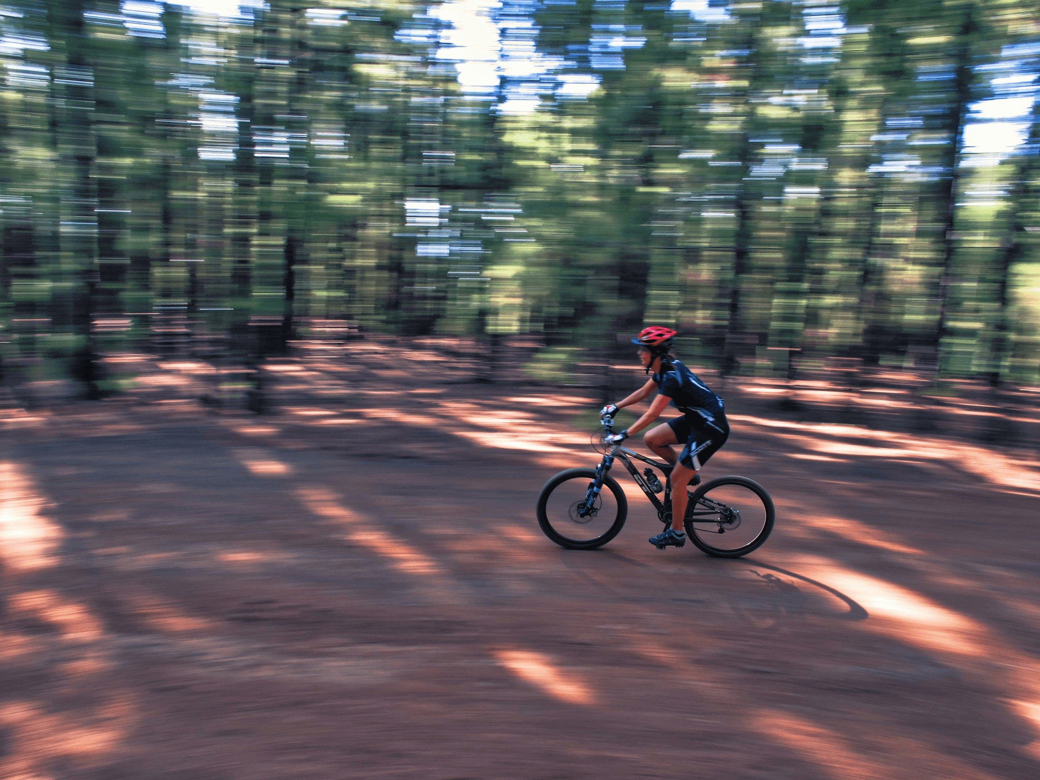 man wearing clear mountain biking glasses navigating rocky terrain