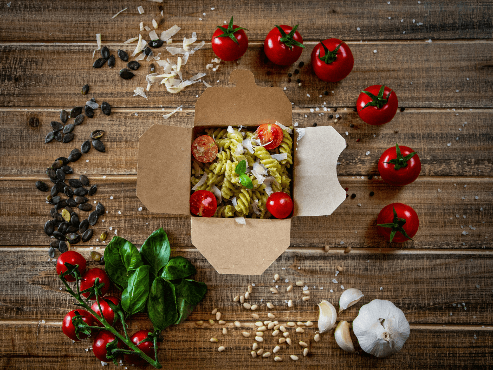 Clear take out containers showcasing vibrant meals.