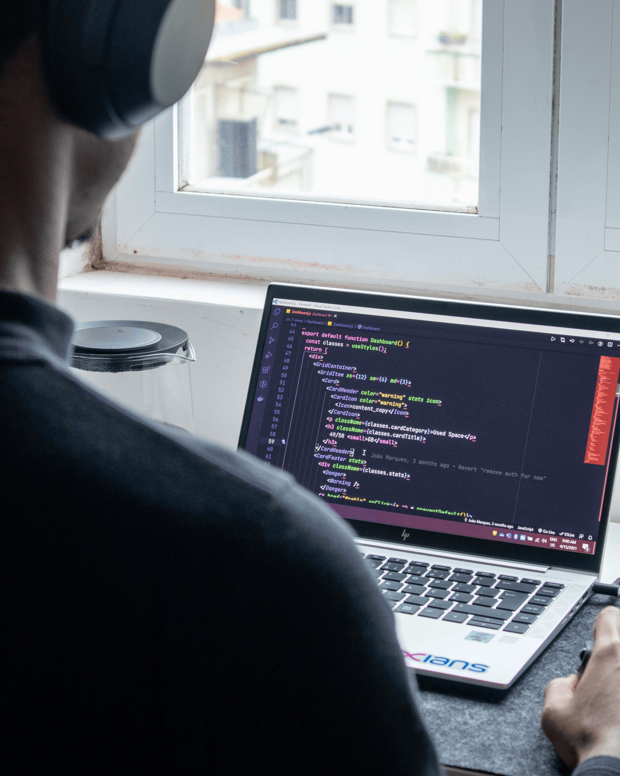 Illustration of person using cheap website builder on laptop