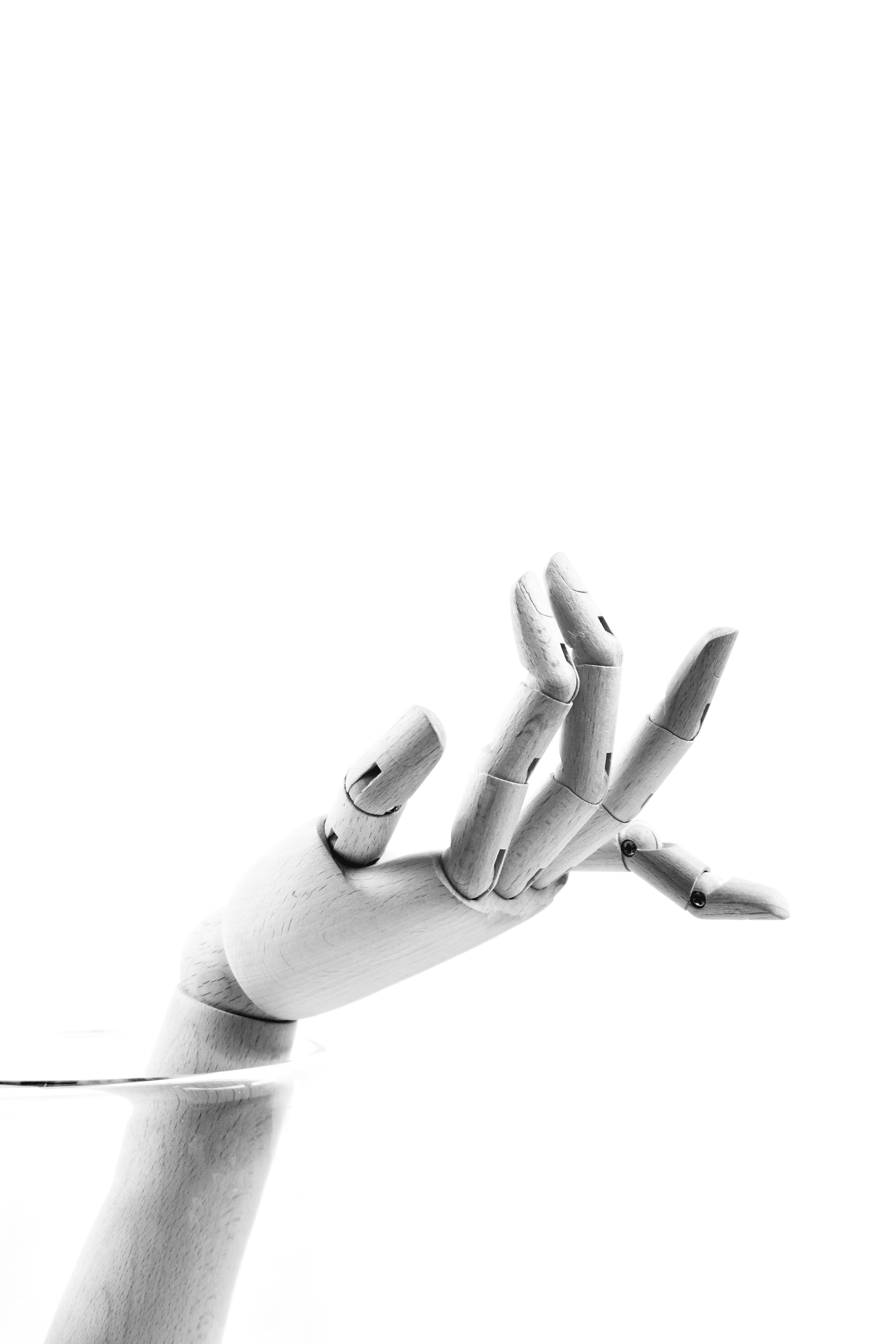 How do I find a sourcing agent - Artificial Intelligence shaking hands with human