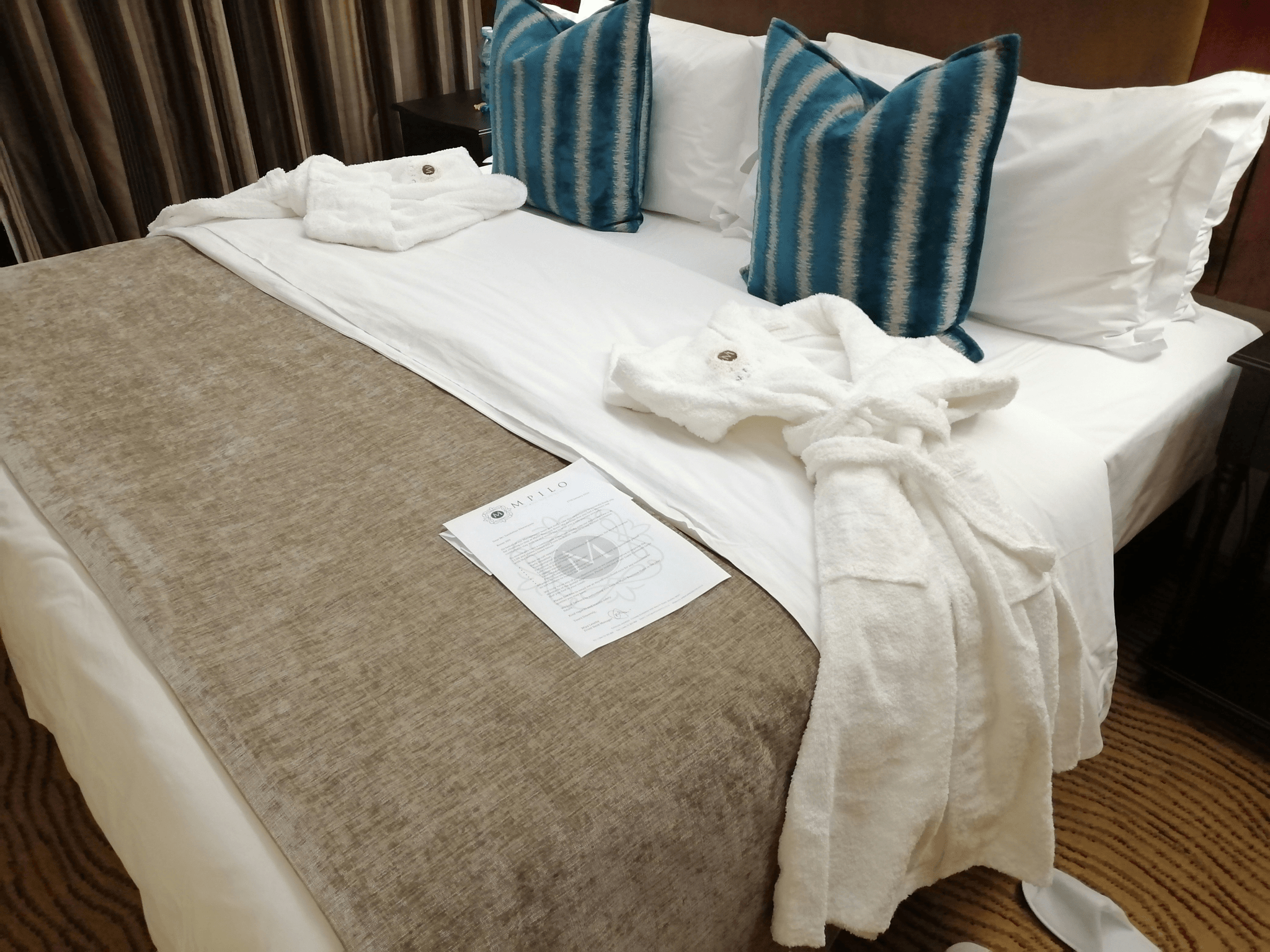 Airbnb host creating clean and comfortable space for guest comfort