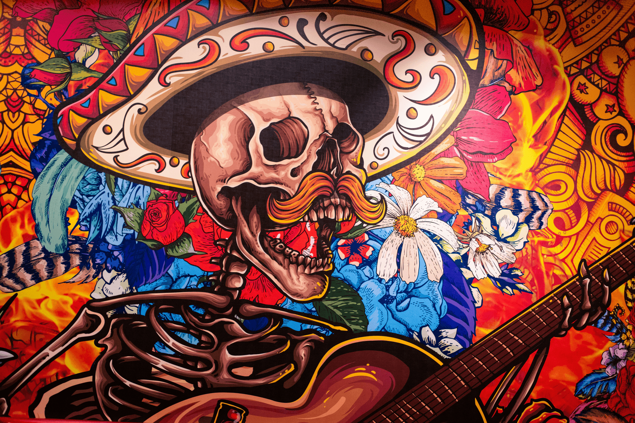 Colorful Latino pop art illustration of a skeleton playing guitar with floral patterns and cultural design elements