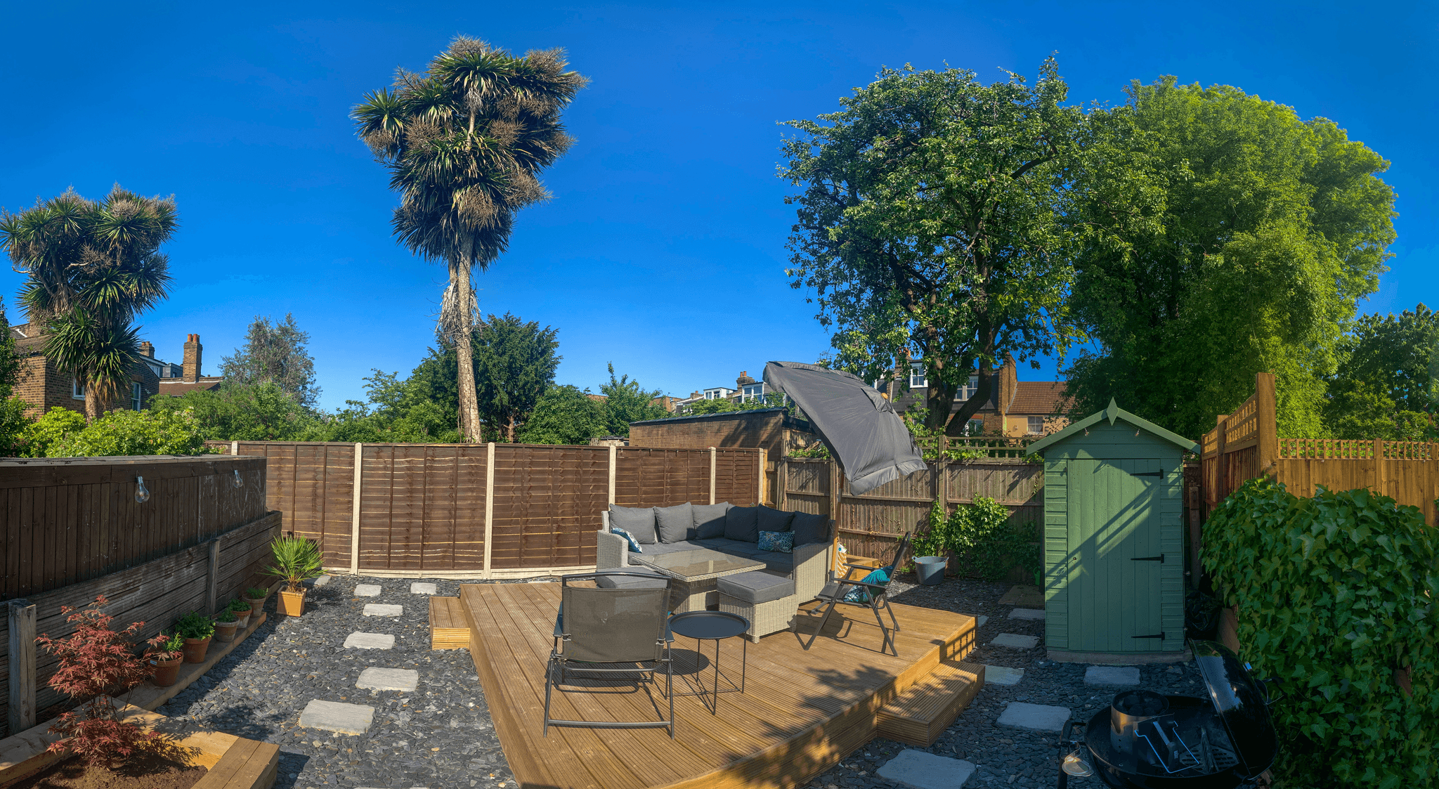 garden design decking in a stunning sloping backyard