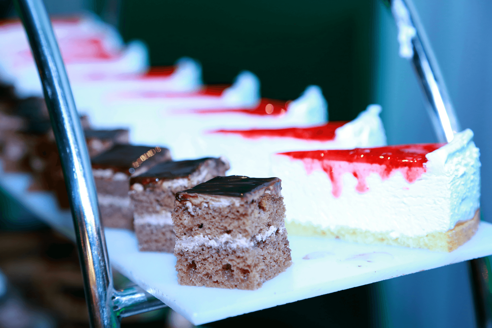 Custom cake boxes showcasing elegant designs and logos.