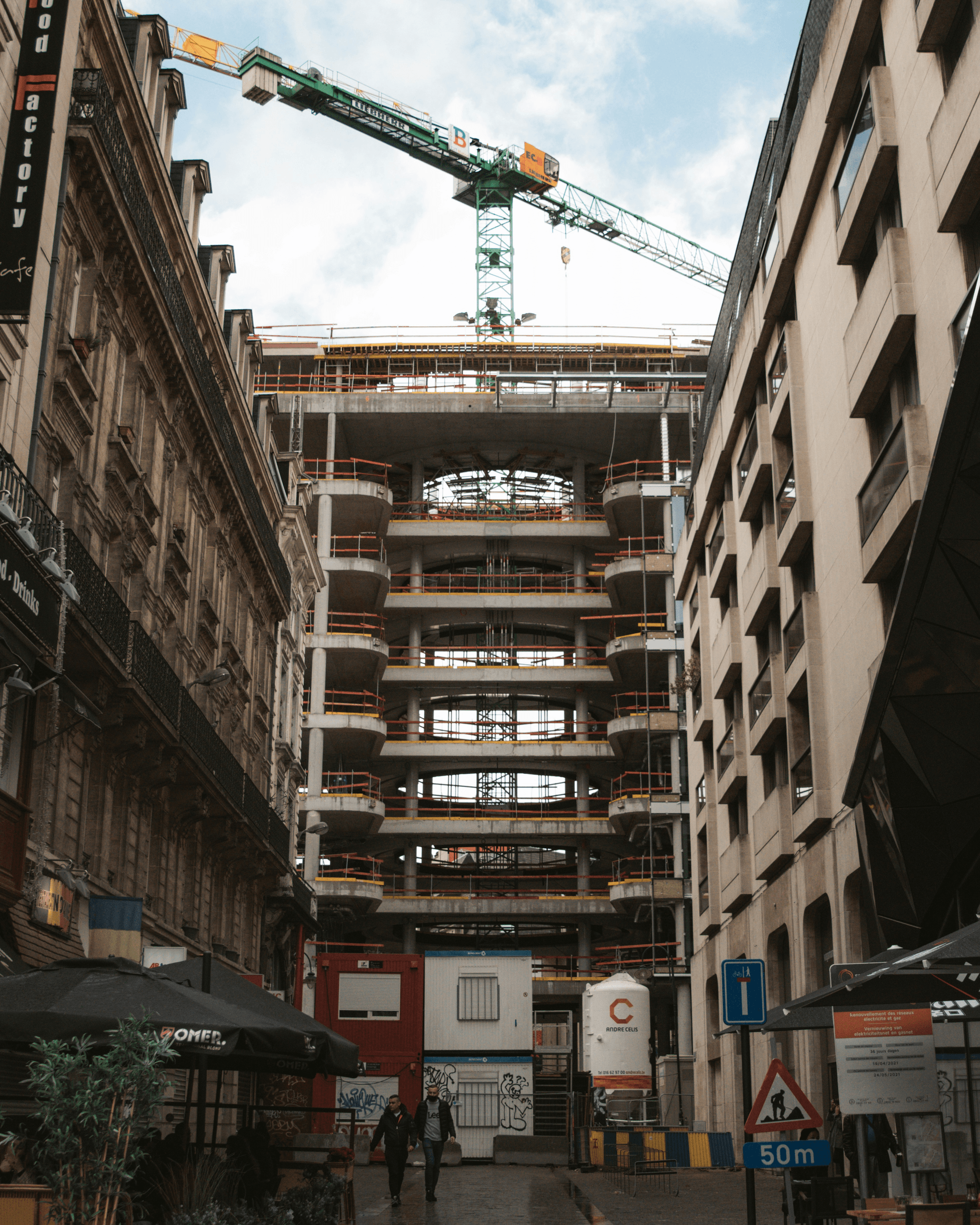 prefabricated hotel building under construction with modular sections being assembled