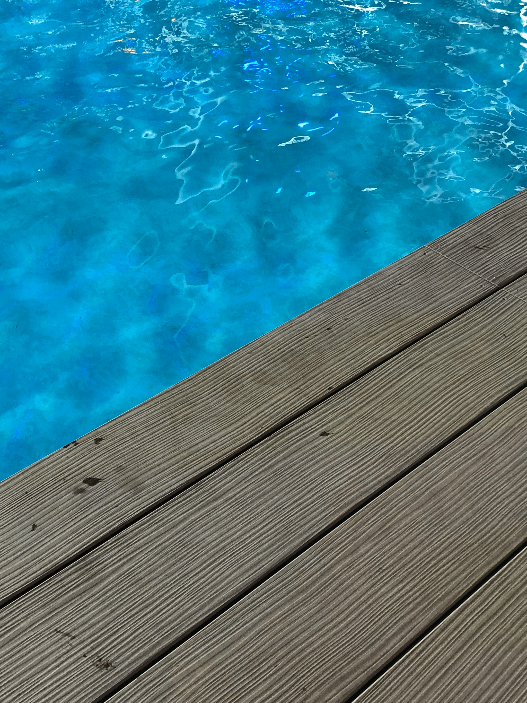 composite deck for above ground pool showcasing stylish lounging area