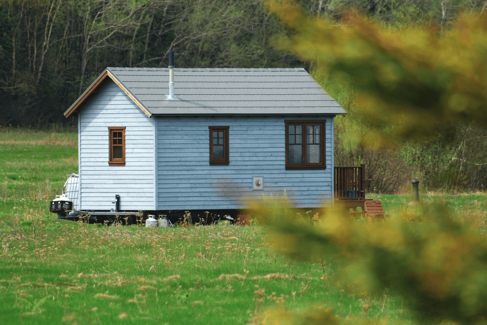 Cozy prefab tiny cabin surrounded by nature