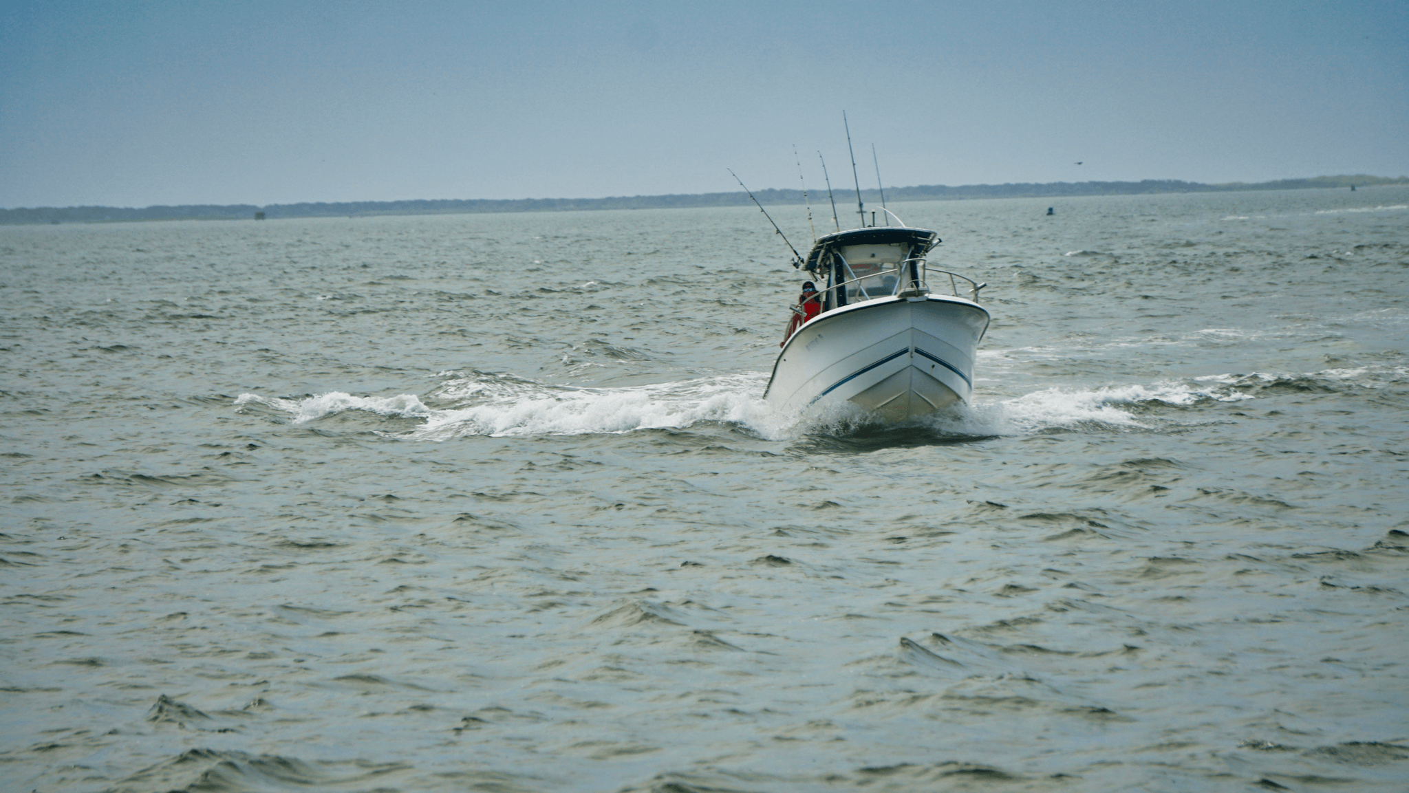 V bottom aluminum boat navigating through rough seas